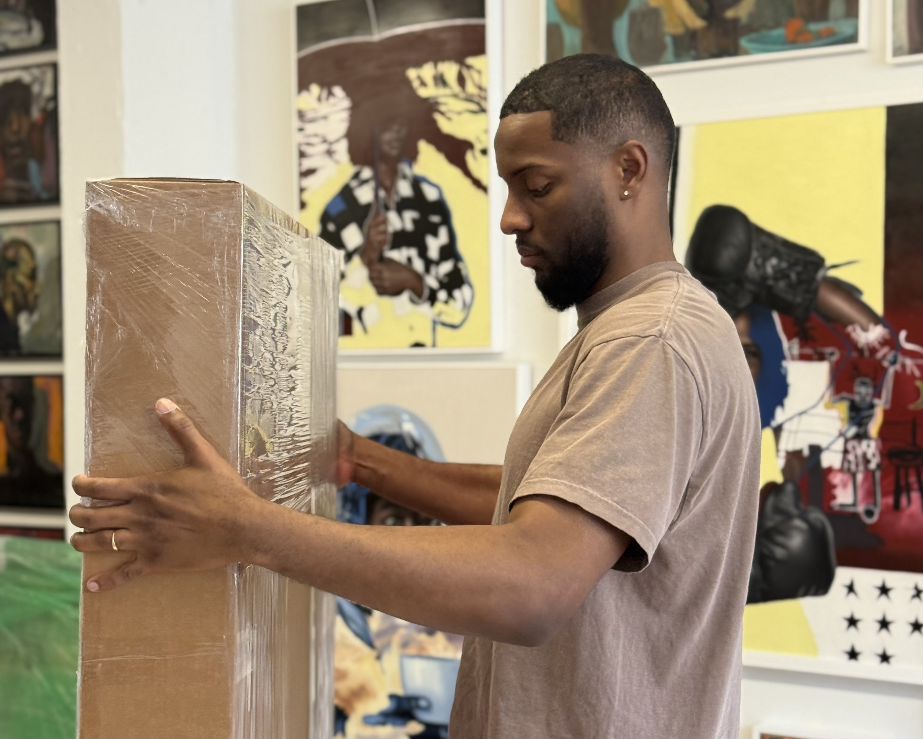 Careful packing of artwork in workshop