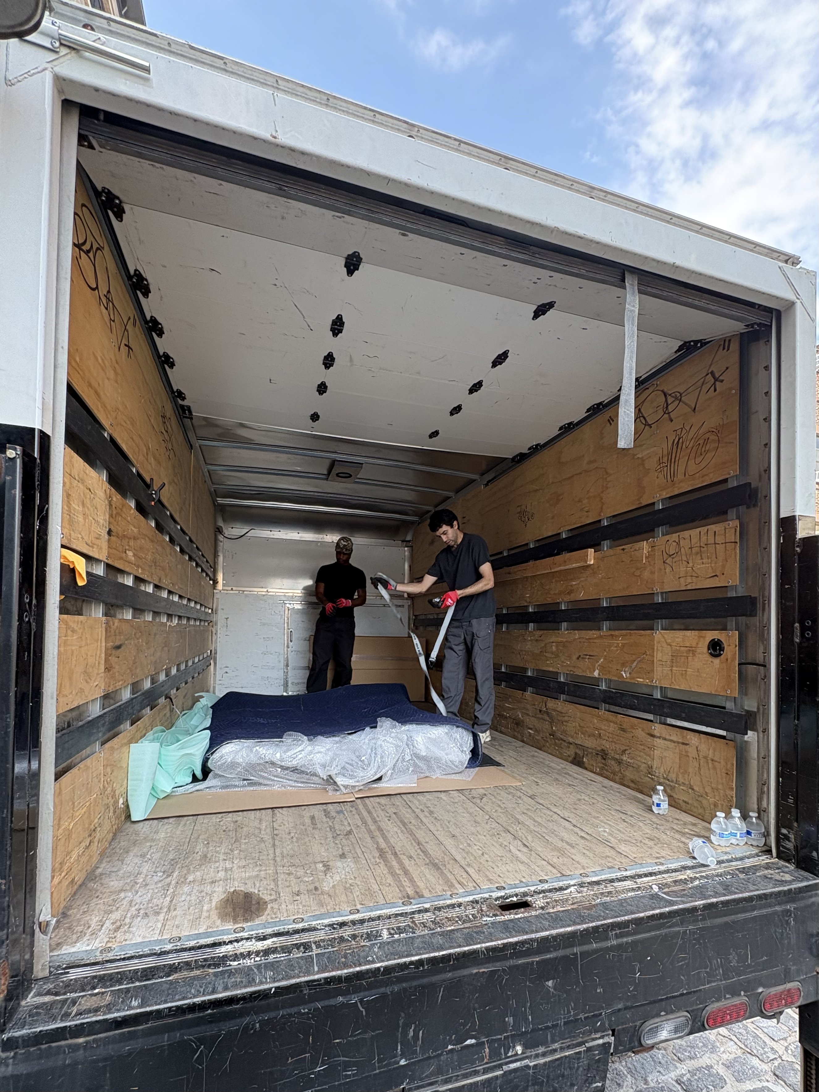 Artwork being loaded into transport vehicle