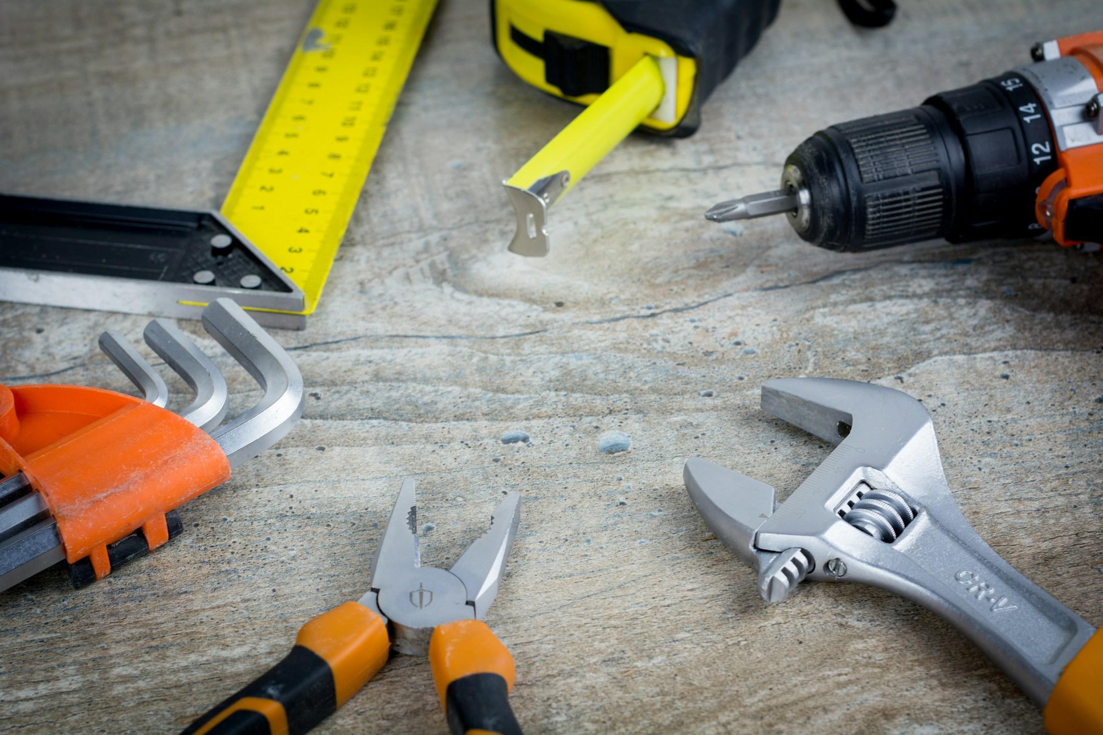 Construction tools on wooden background with copy space  Finance