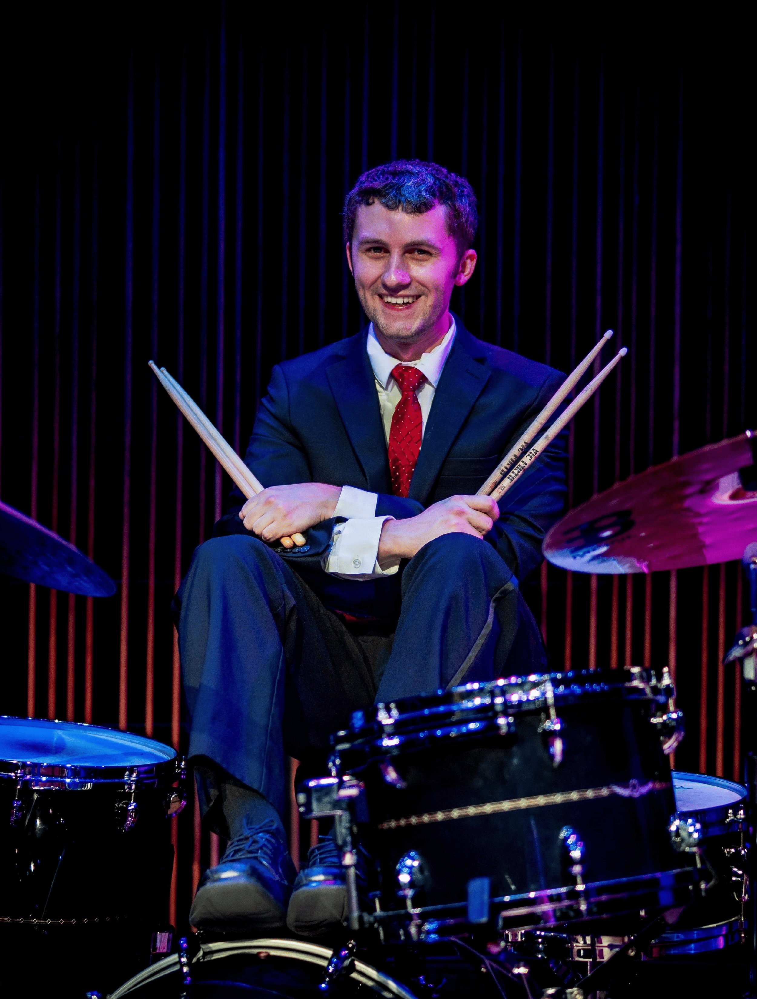 jackson on drum set picture 2 (2).png