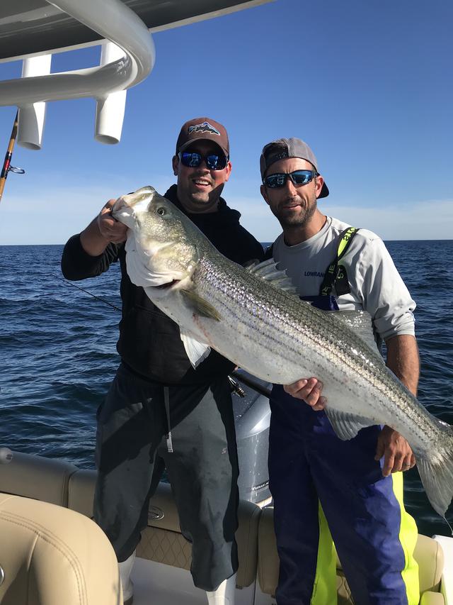 Captains Rick and Mike of 1620 Anglers posing with a fish
