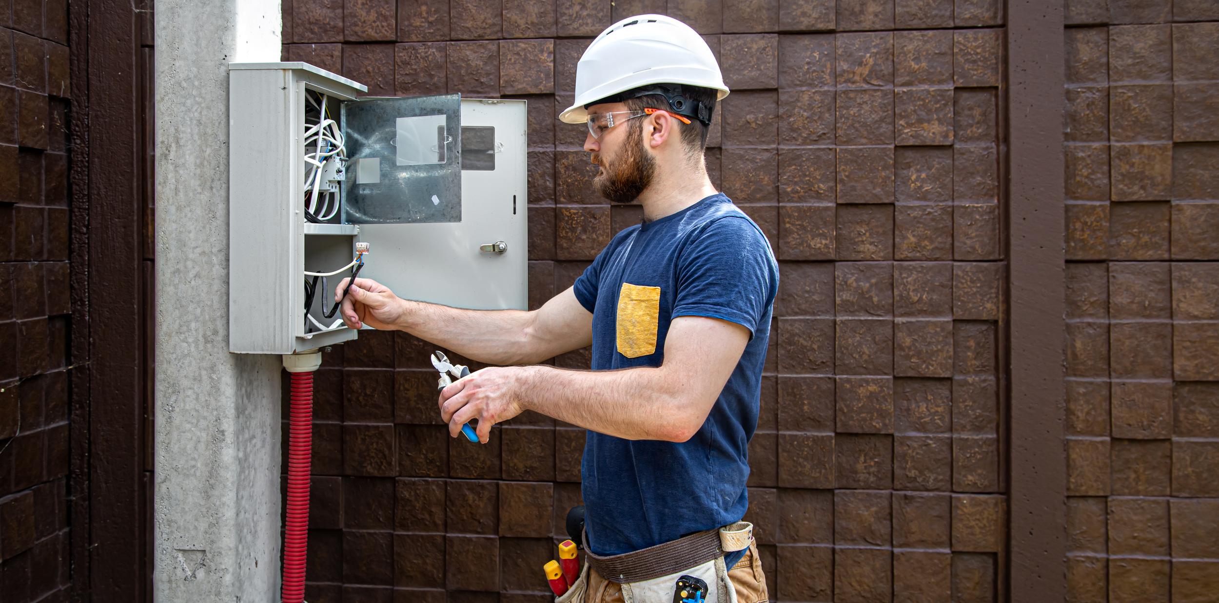 electrician-builder-at-work-examines-the-cable-co-2026-01-08-22-31-03-utc.jpg