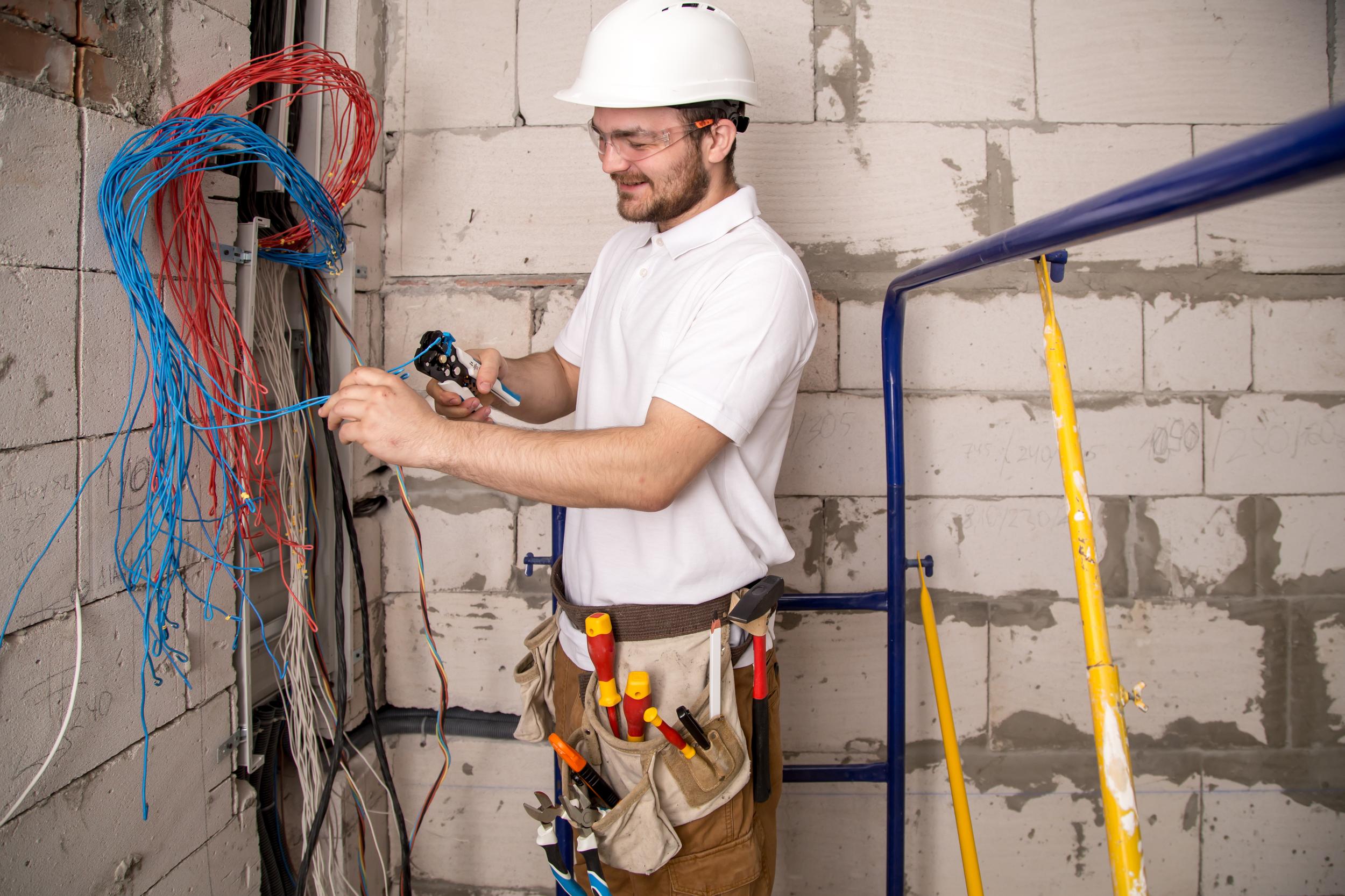 electrician-working-near-the-board-with-wires-ins-2026-01-08-07-38-46-utc.jpg