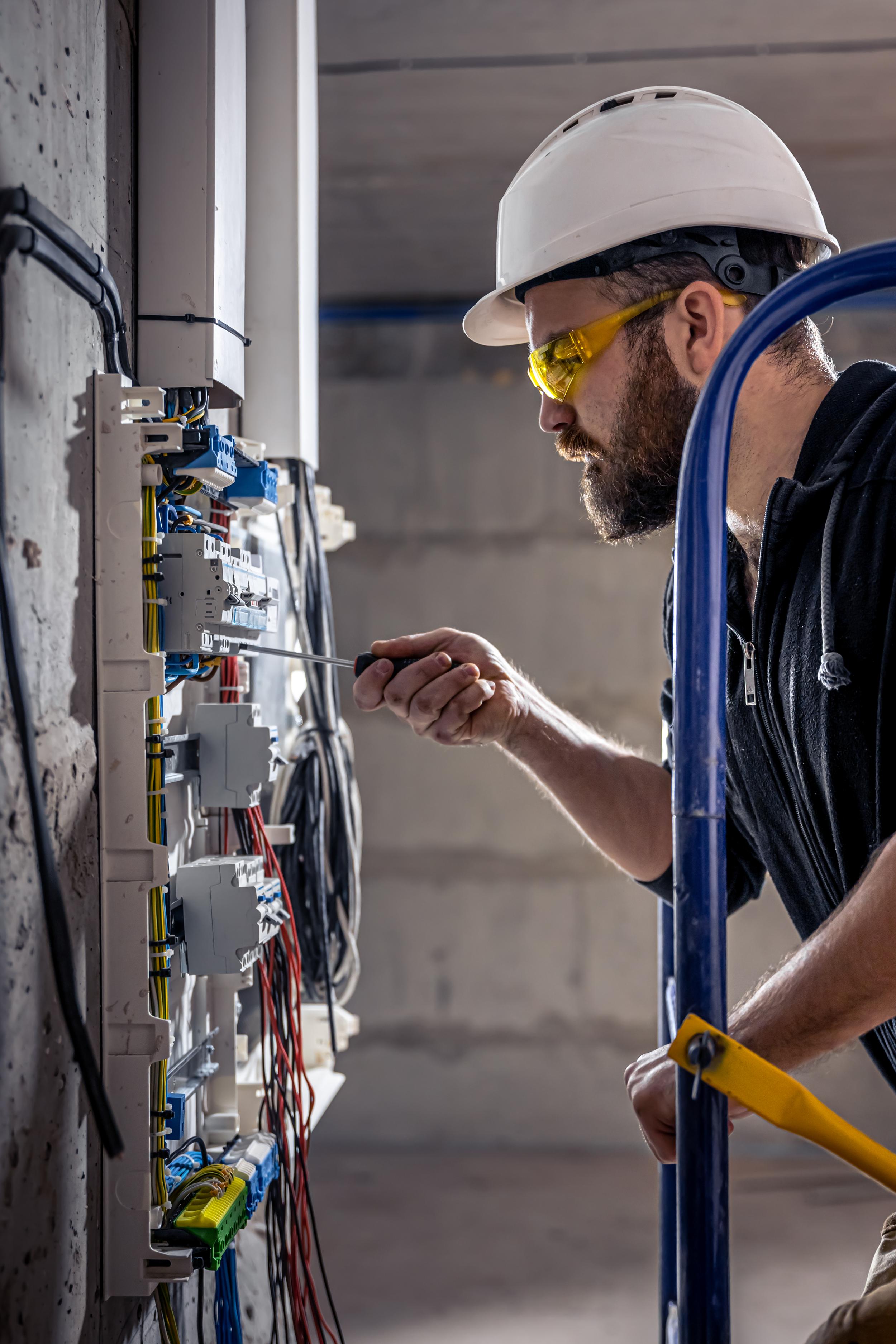 a-male-electrician-works-in-a-switchboard-with-an-2026-01-08-22-05-06-utc.jpg