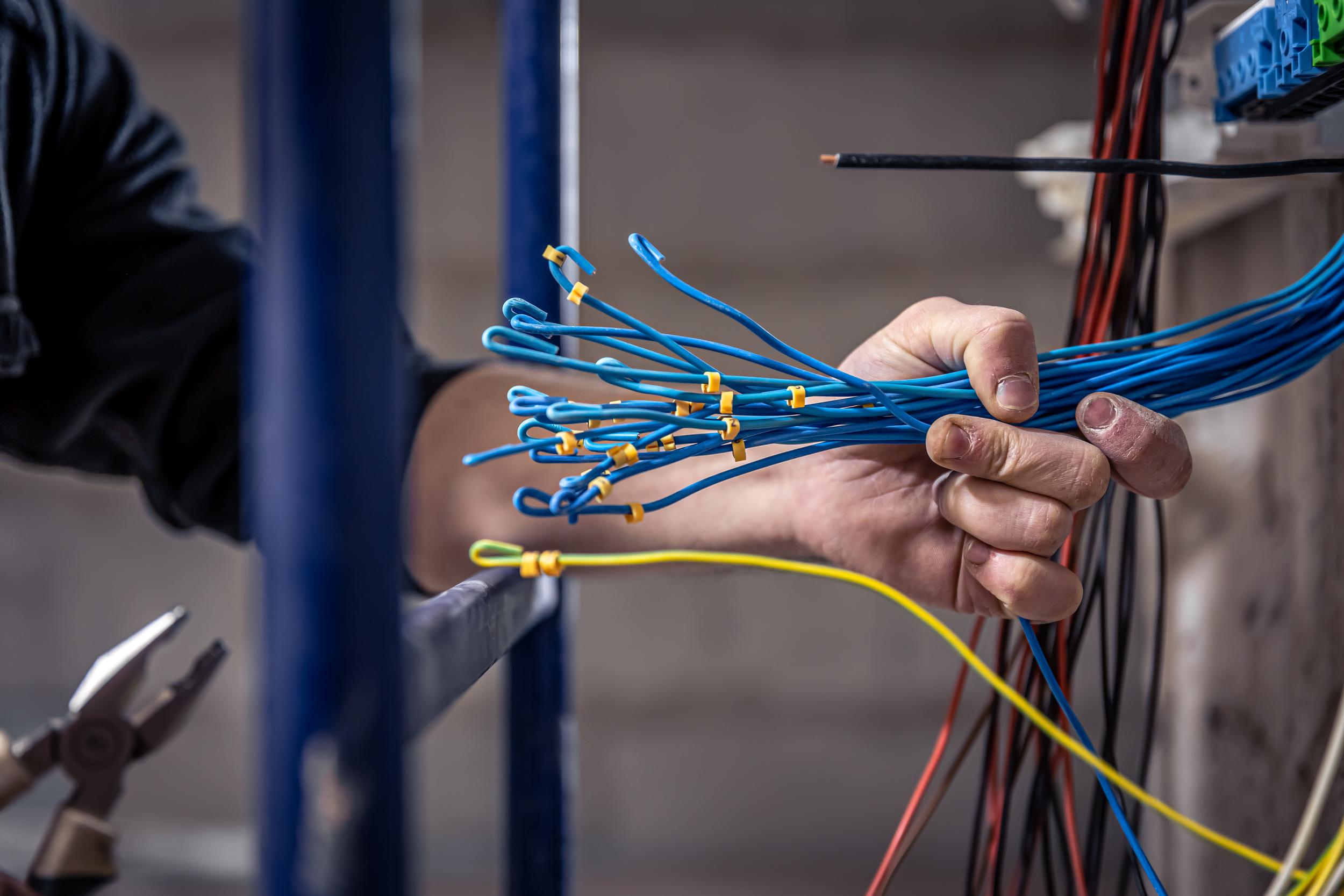 a-male-electrician-works-in-a-switchboard-with-an-2026-01-08-23-44-15-utc.jpg