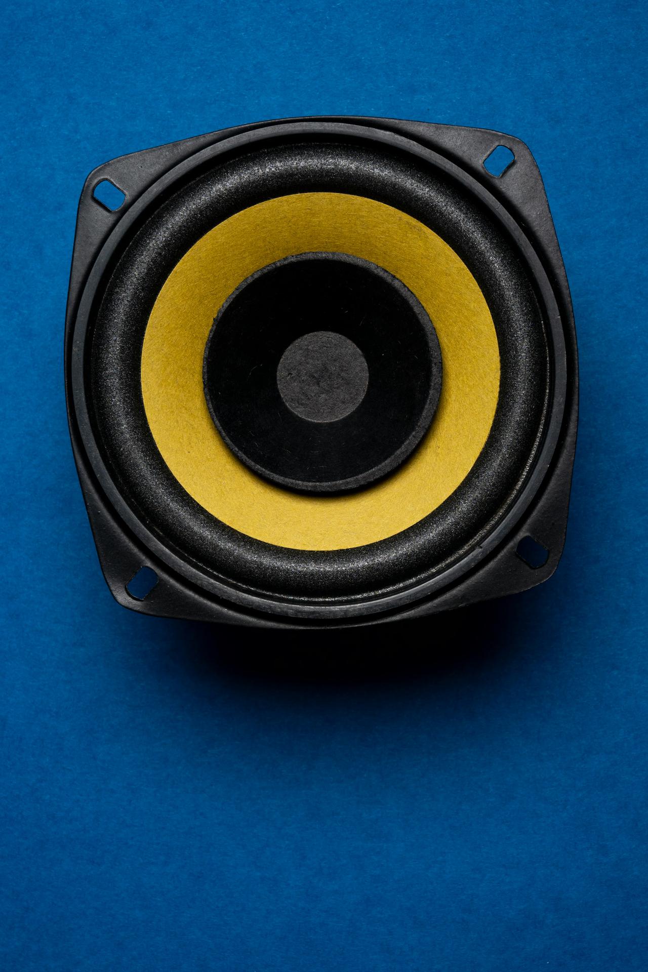 Audio speaker isolated on blue background, Music system background