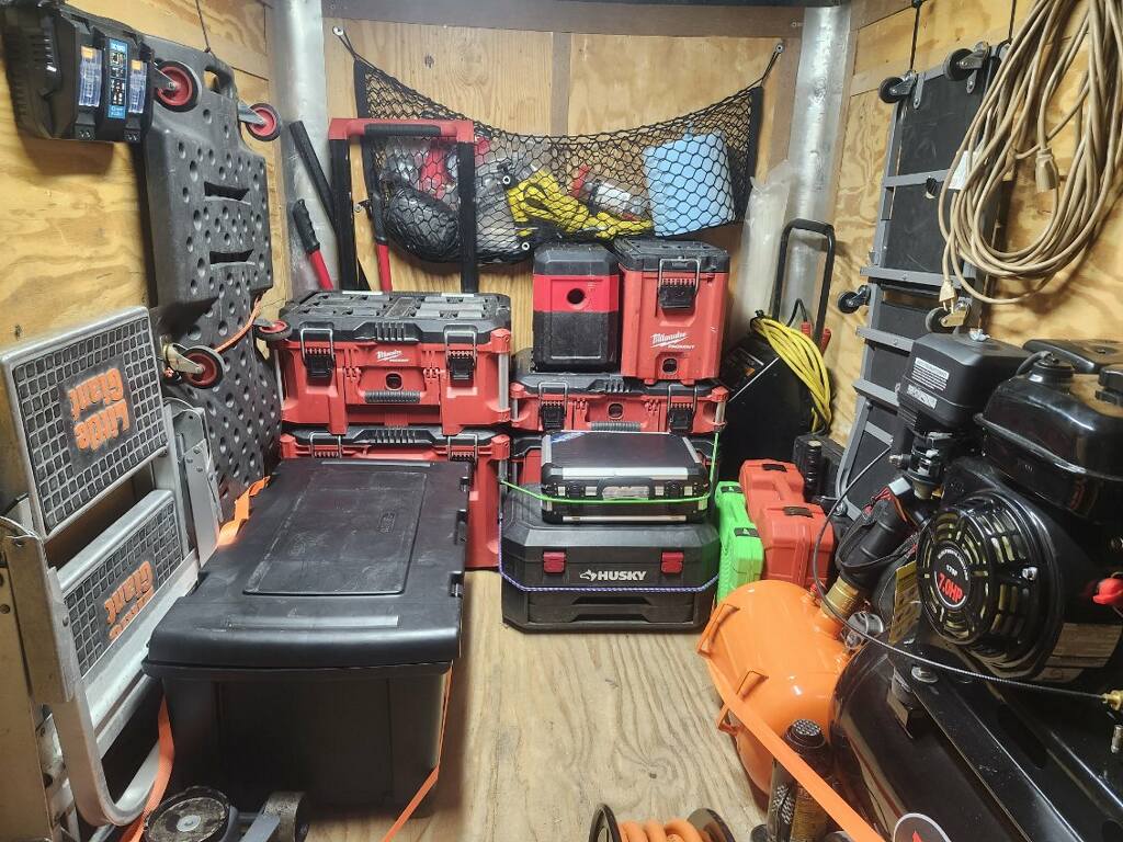 Professional well-organized automotive repair shop interior with clean workspace and organized tools
