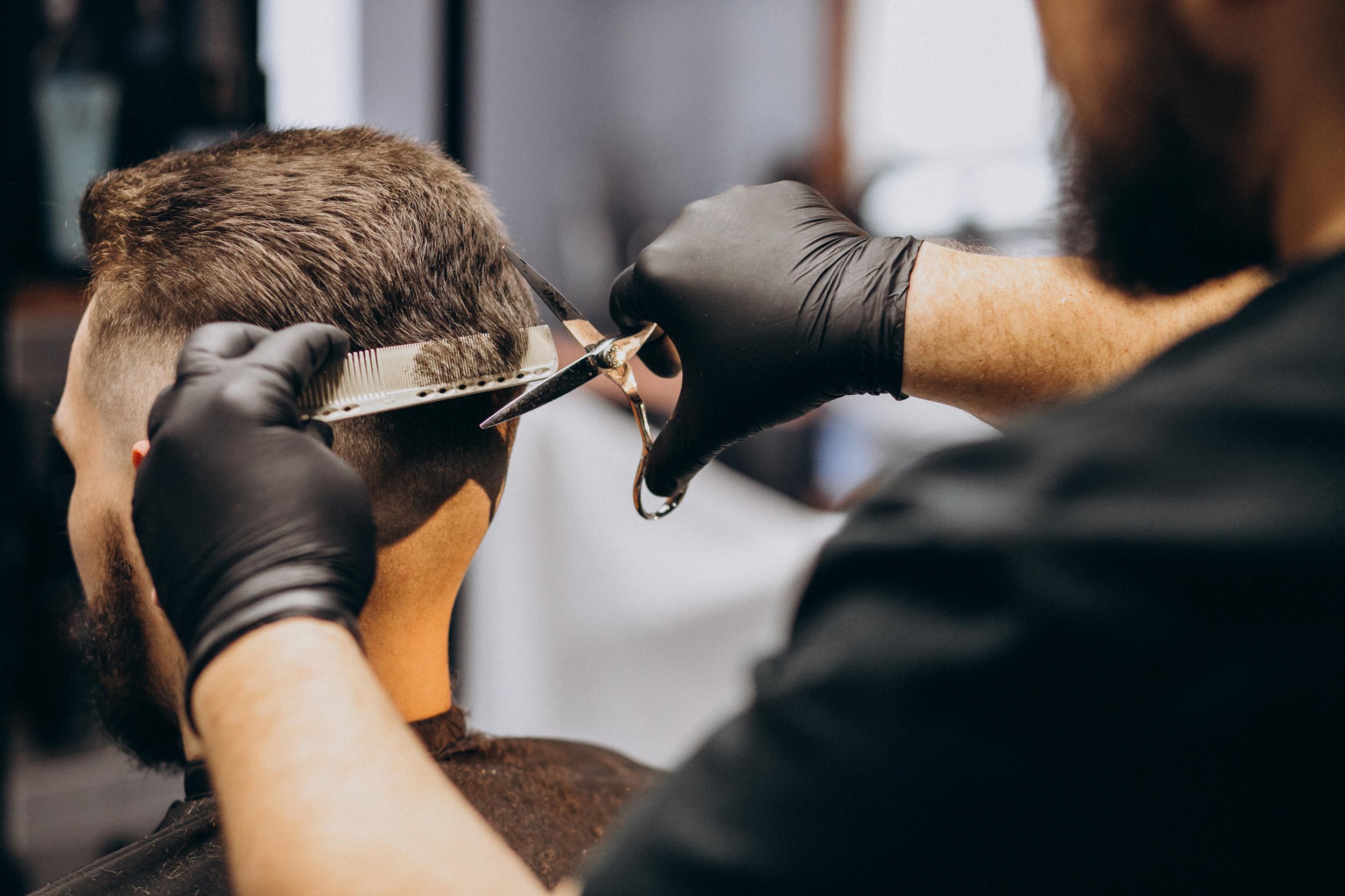 client-doing-hair-cut-barber-shop-salon.jpg