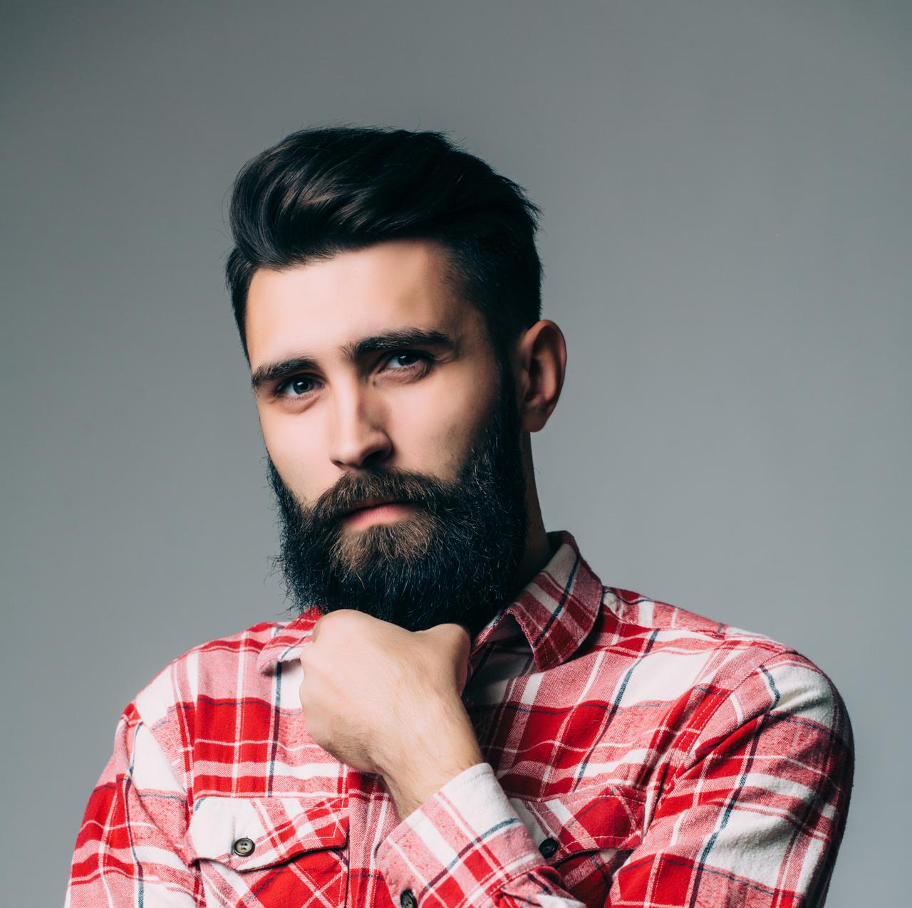 portrait-handsome-single-bearded-young-man-with-serious-expression-gray-wall-with-copy-space 1.jpg