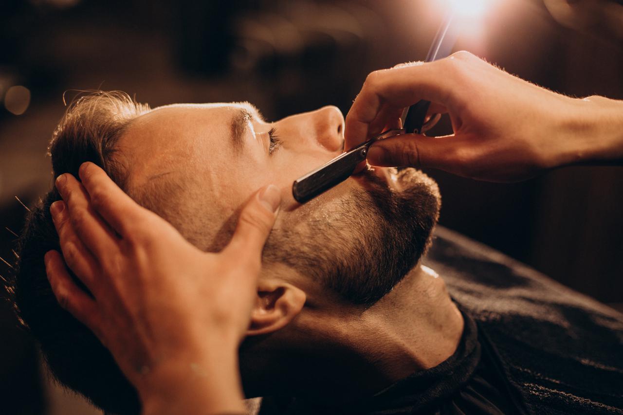 handsome-man-shaving-beard-barbershop.jpg