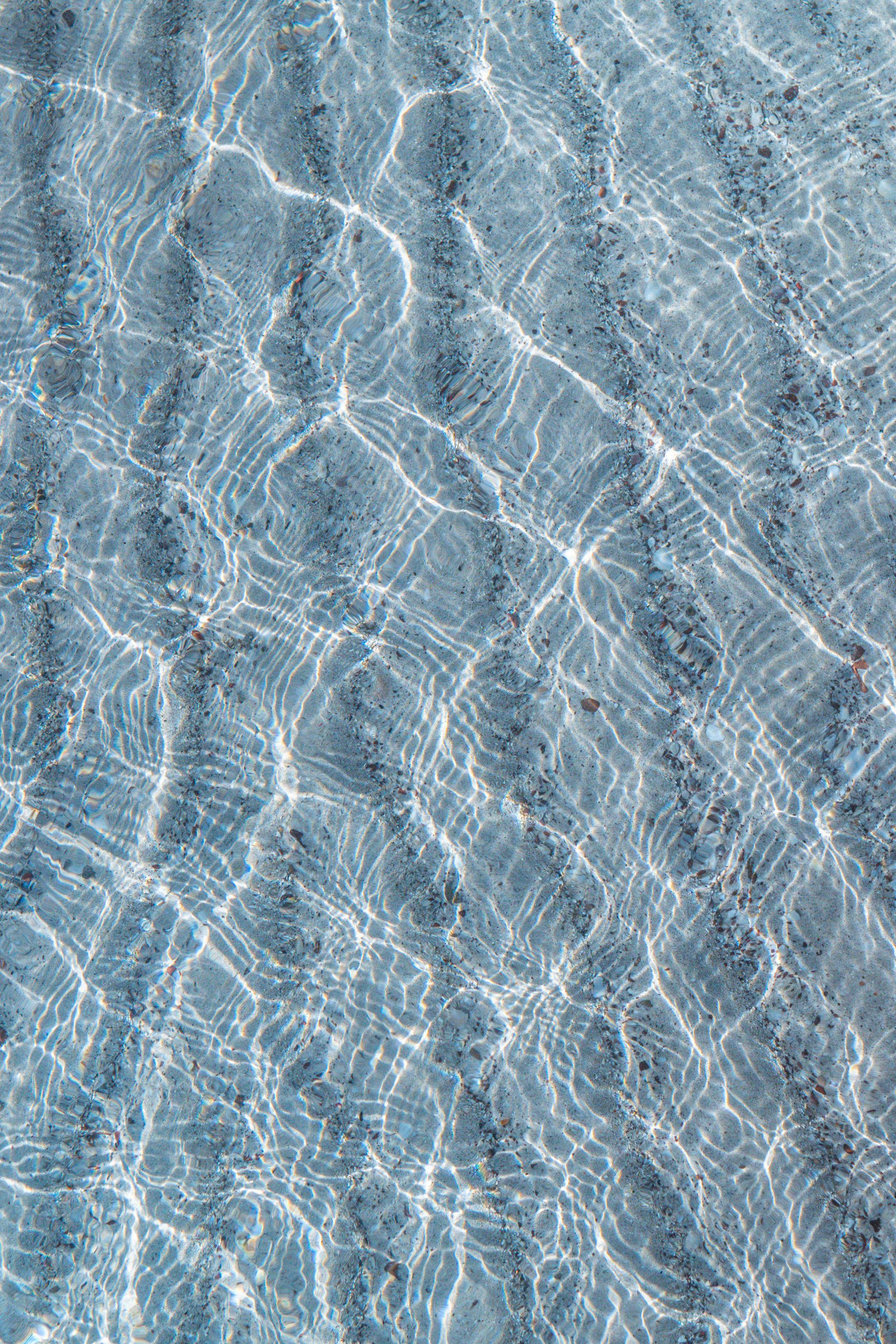 Clear water ripples creating beautiful textures with natural light reflections.