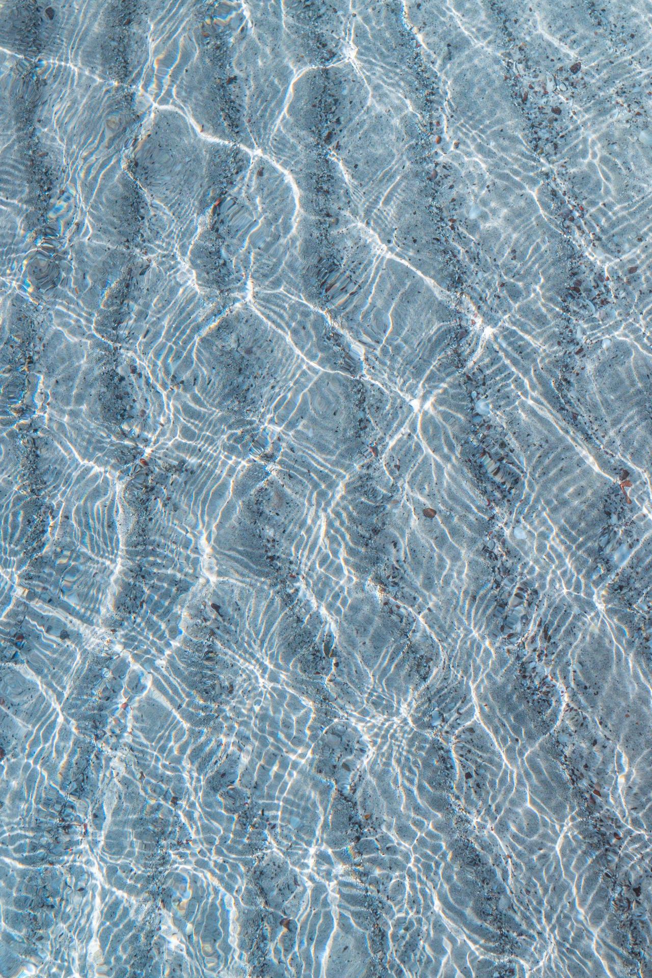 Clear water ripples creating beautiful textures with natural light reflections.