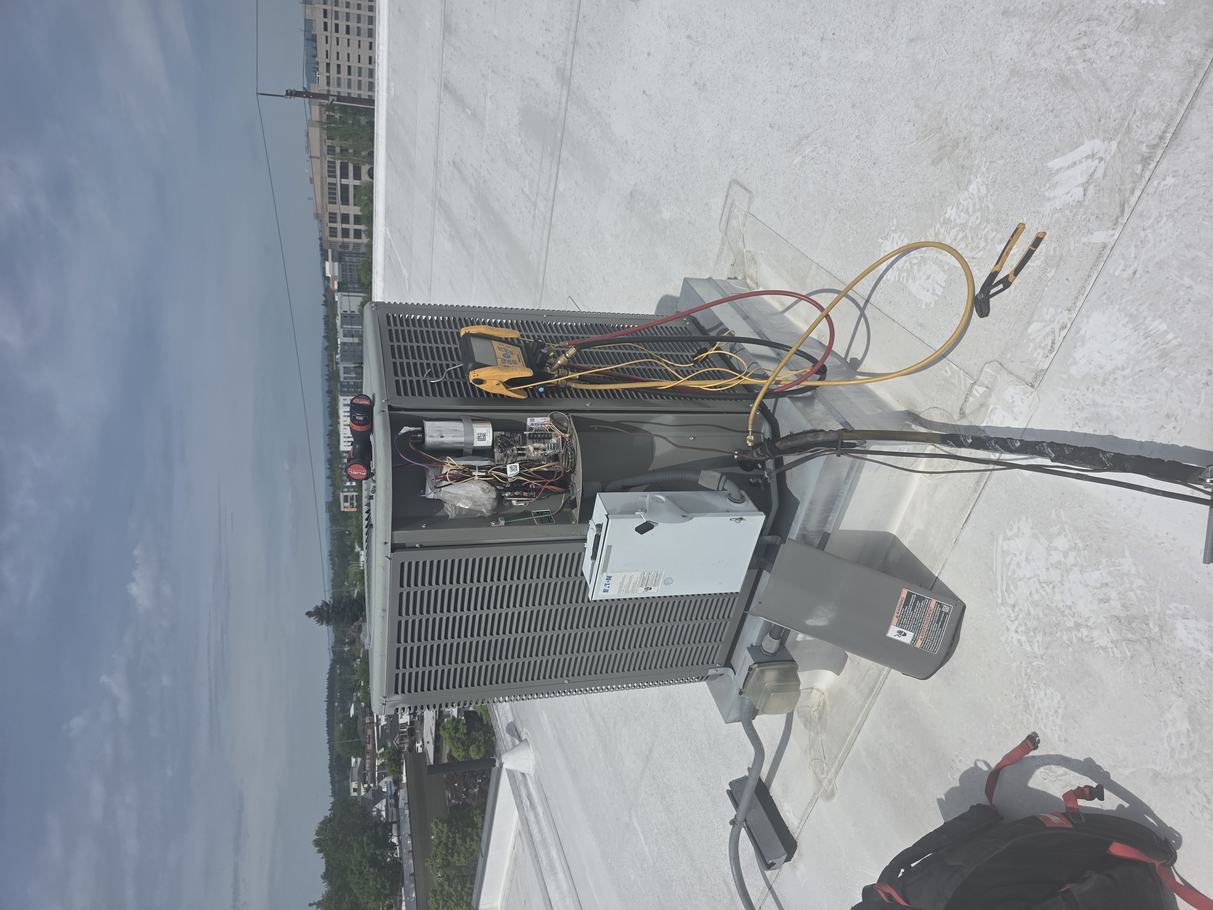 Professional HVAC unit installation with technician