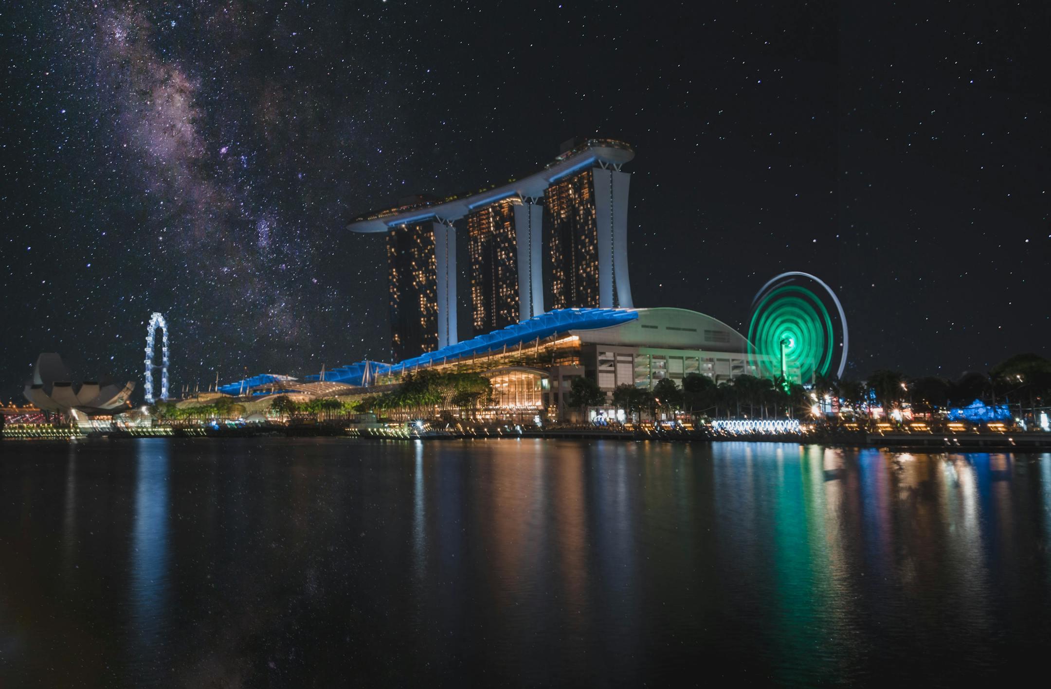 Stunning night view of Marina Bay Sands with starry sky and reflections in Singapore.