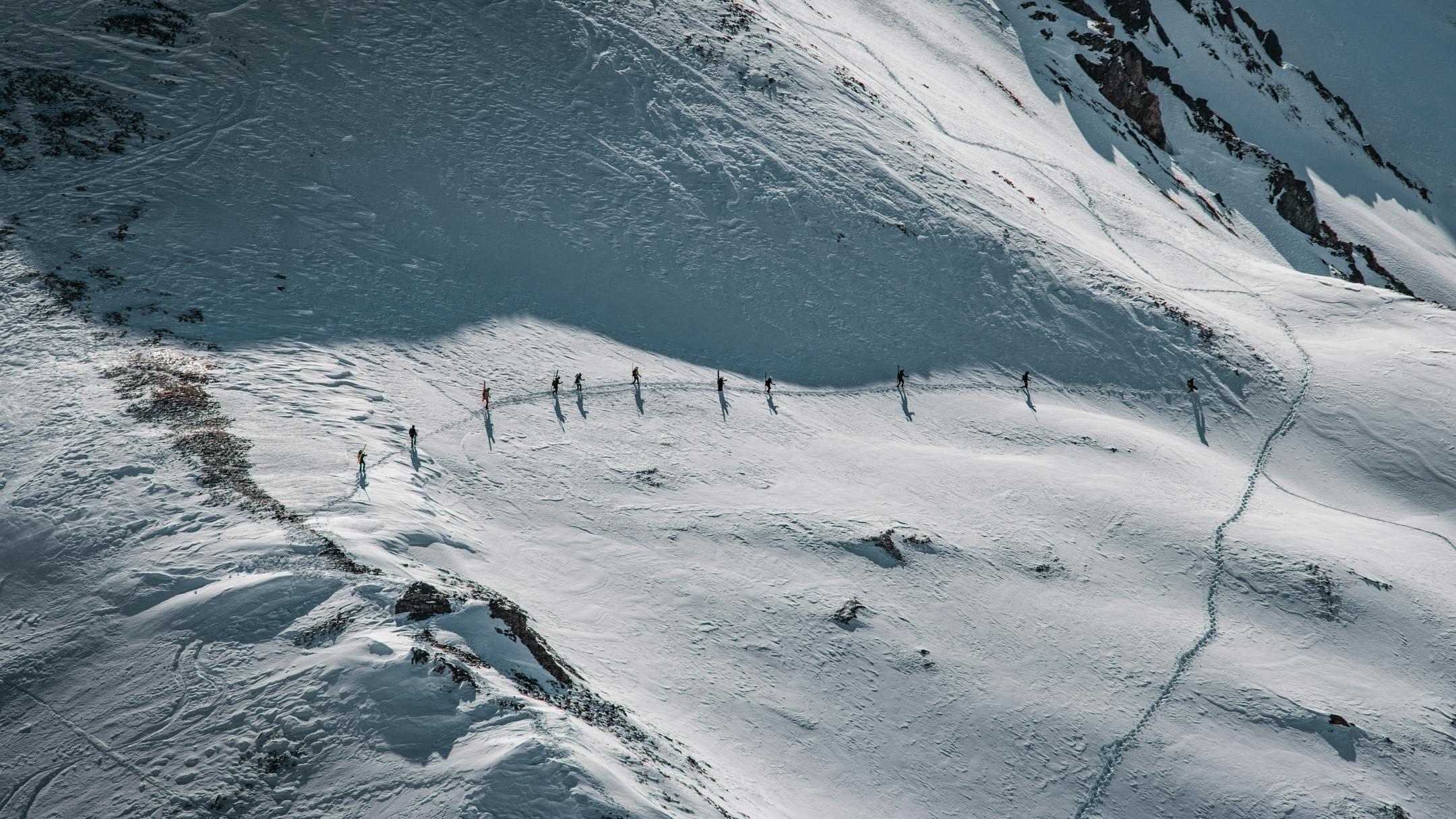 A group of skiers embark on a thrilling ski tour in the snow-covered Alps of Serfaus, Tirol.