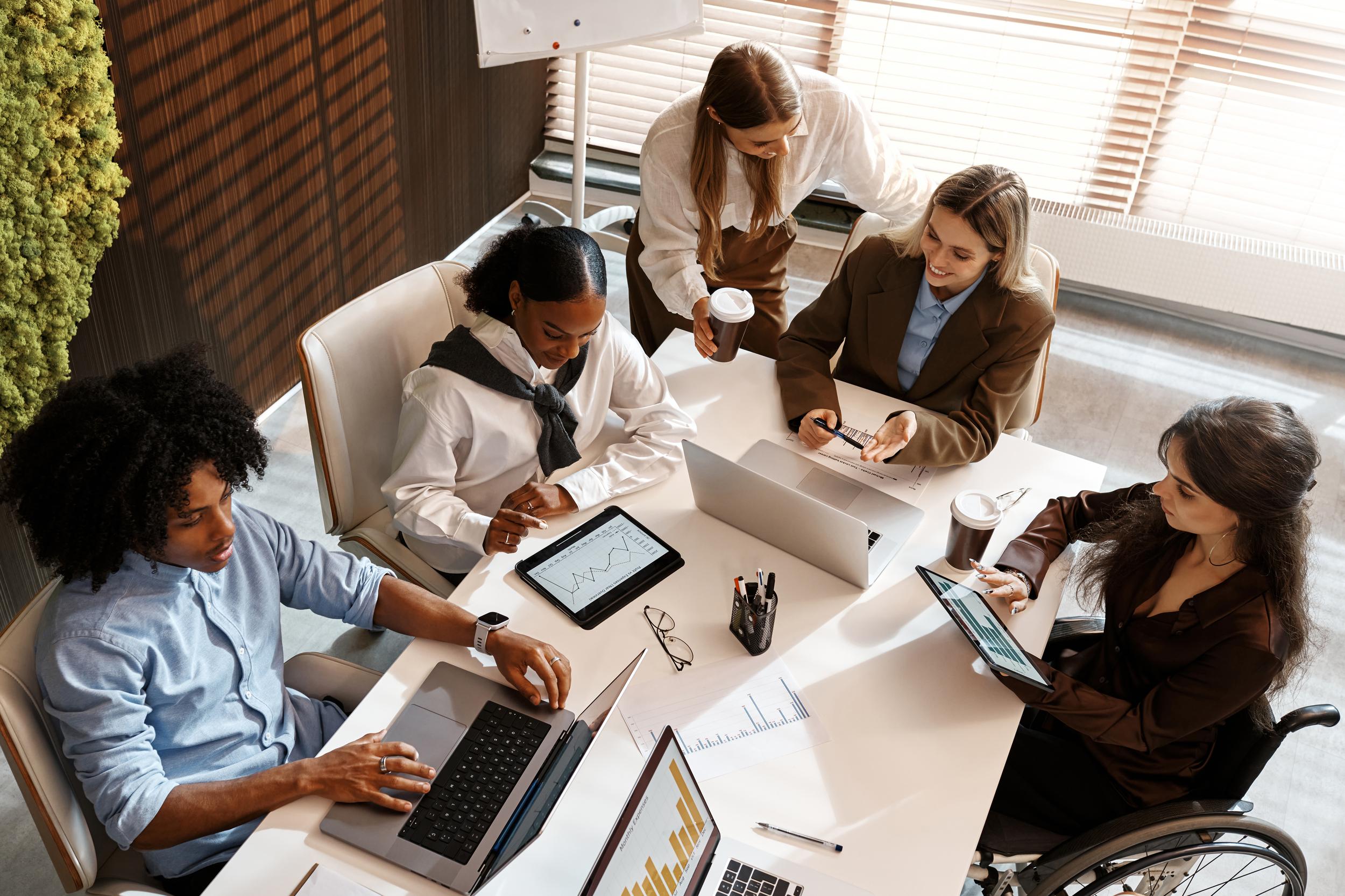 diverse-business-team-analyzing-charts-during-offi-2026-01-11-10-56-35-utc.jpg