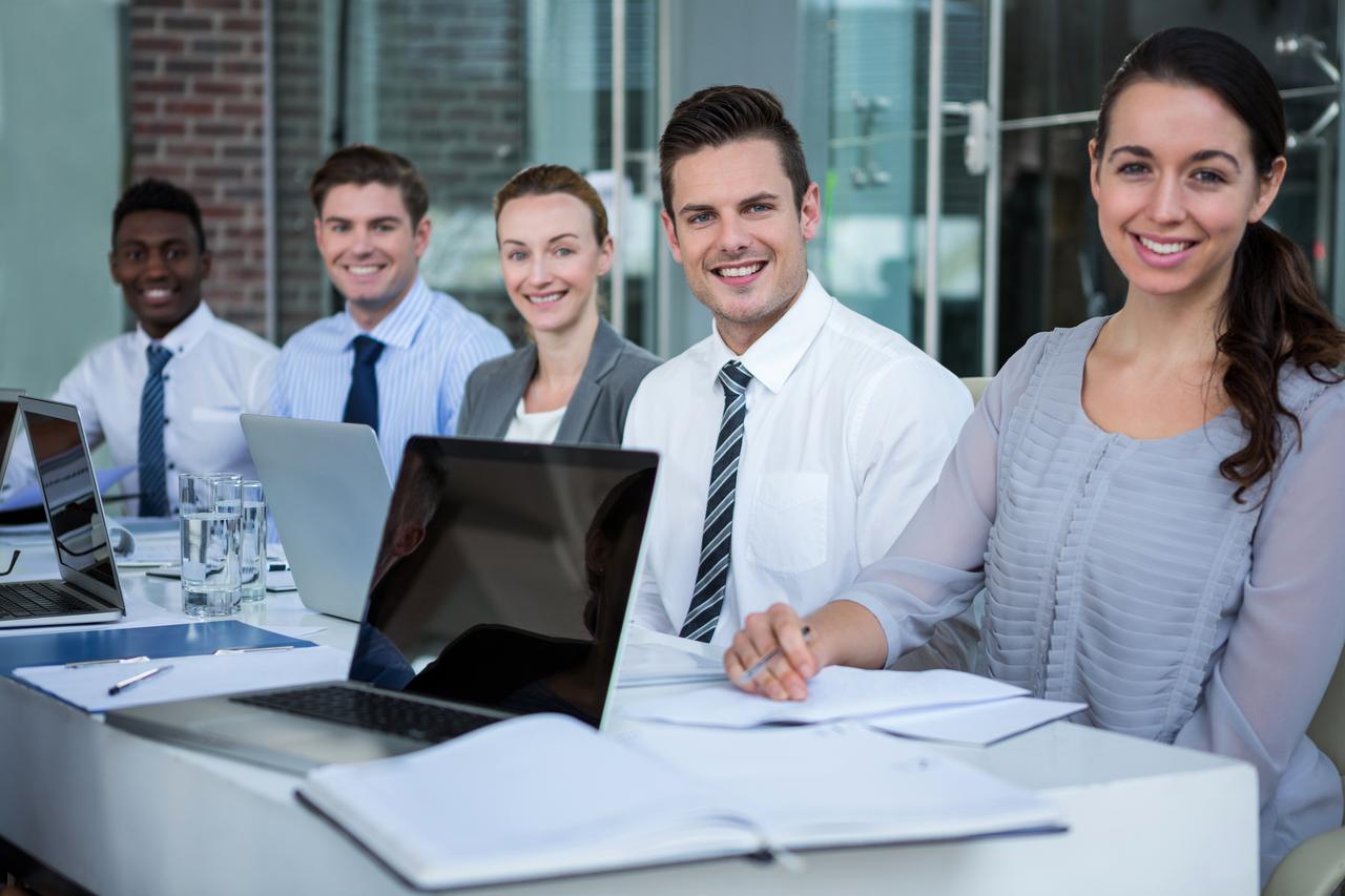 smiling-colleagues-working-together-at-a-table-2026-01-09-08-34-42-utc.jpg