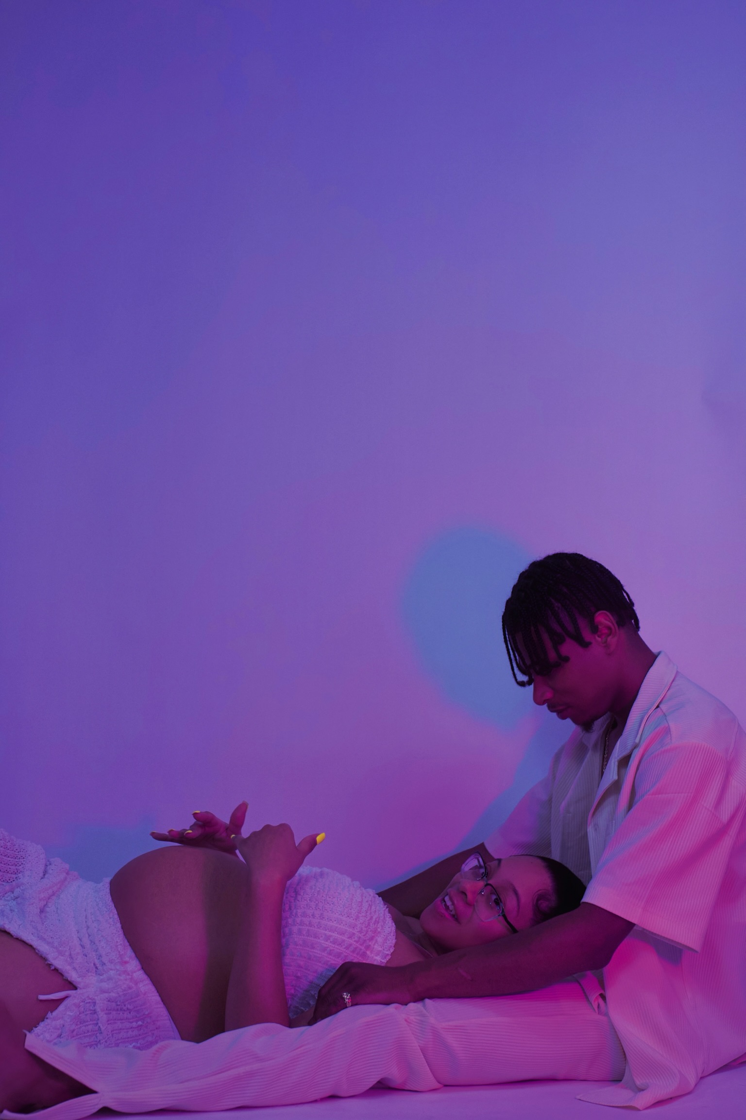 Portrait session with dramatic colored lighting.