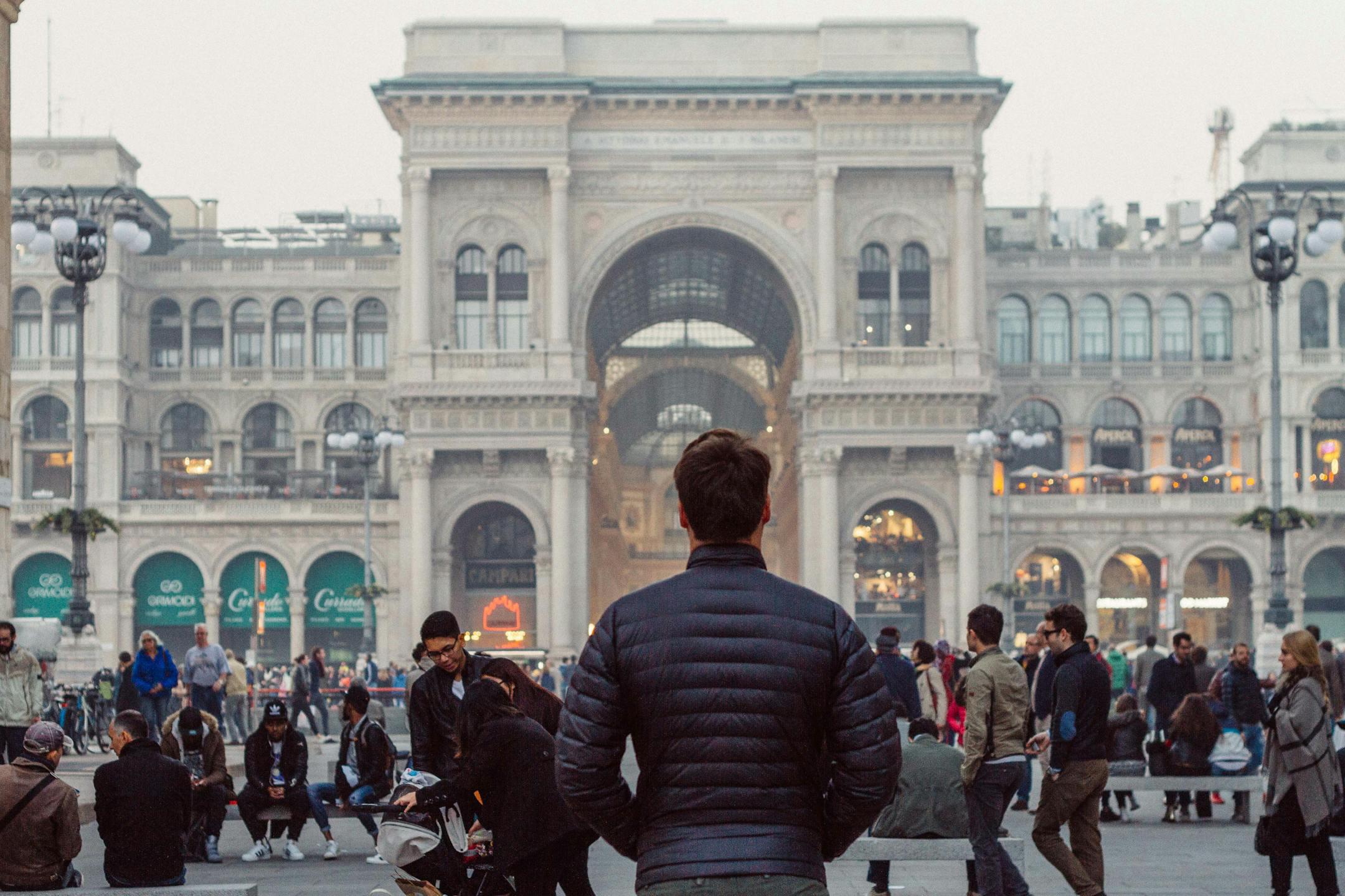People gather outside the iconic Galleria Vittorio Emanuele II in Milan, Italy.