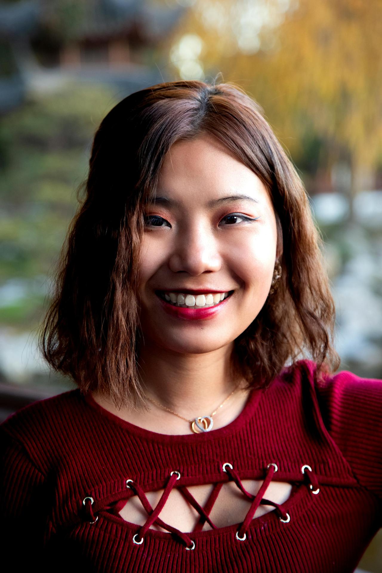 Portrait of a smiling woman enjoying a day outdoors in Los Angeles.