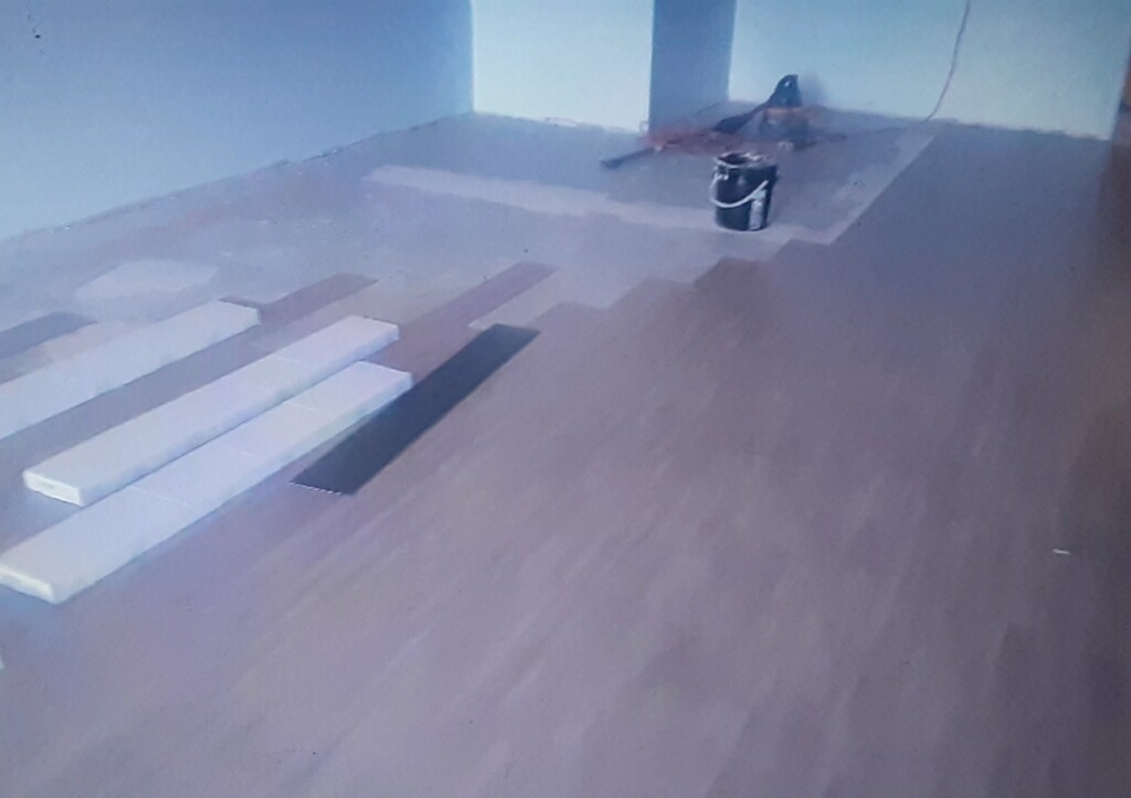 Progress on flooring installation at GNC store