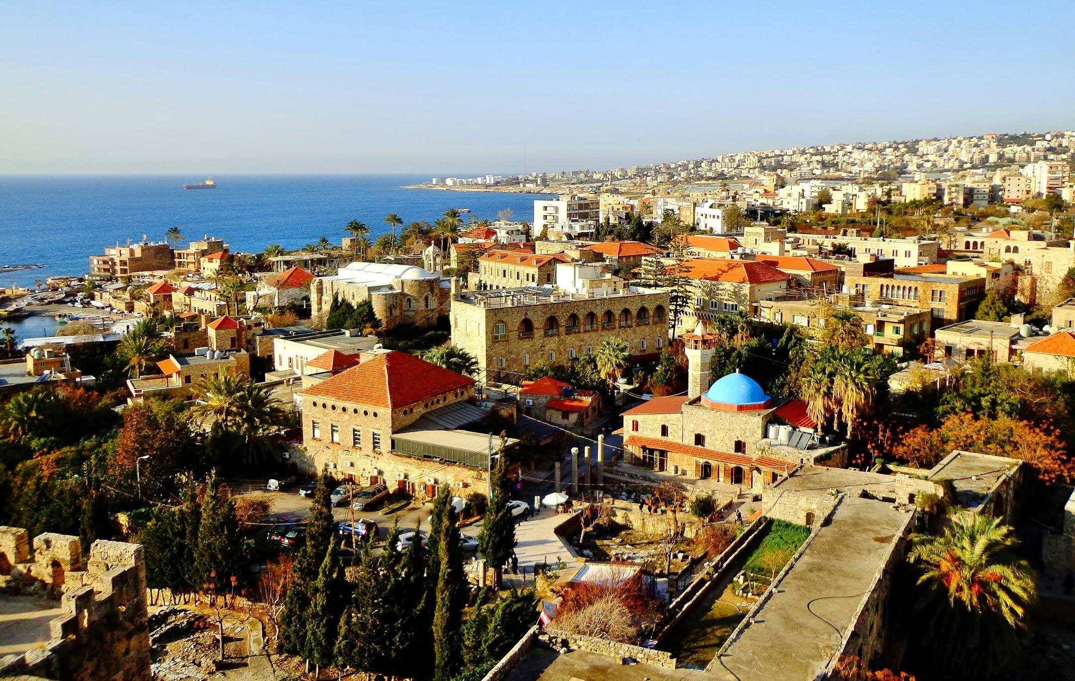 Aerial view of Byblos, Lebanon showcasing historic architecture, coastline, and vibrant city life.