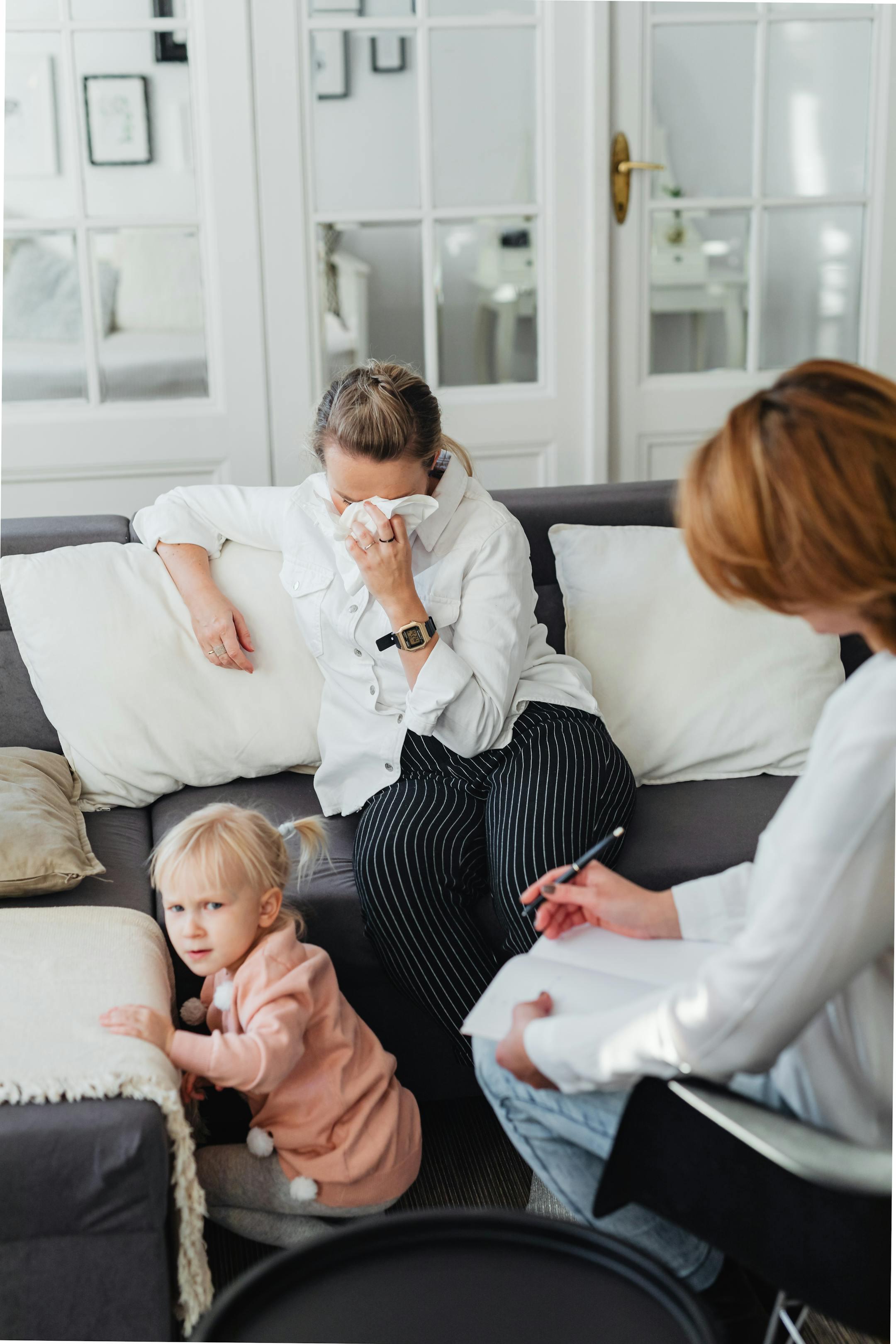 Candid moment of a mother and child during a family therapy session in a cozy living room, representing Cognitive Analytica’s compassionate approach to family and child therapy in Lebanon