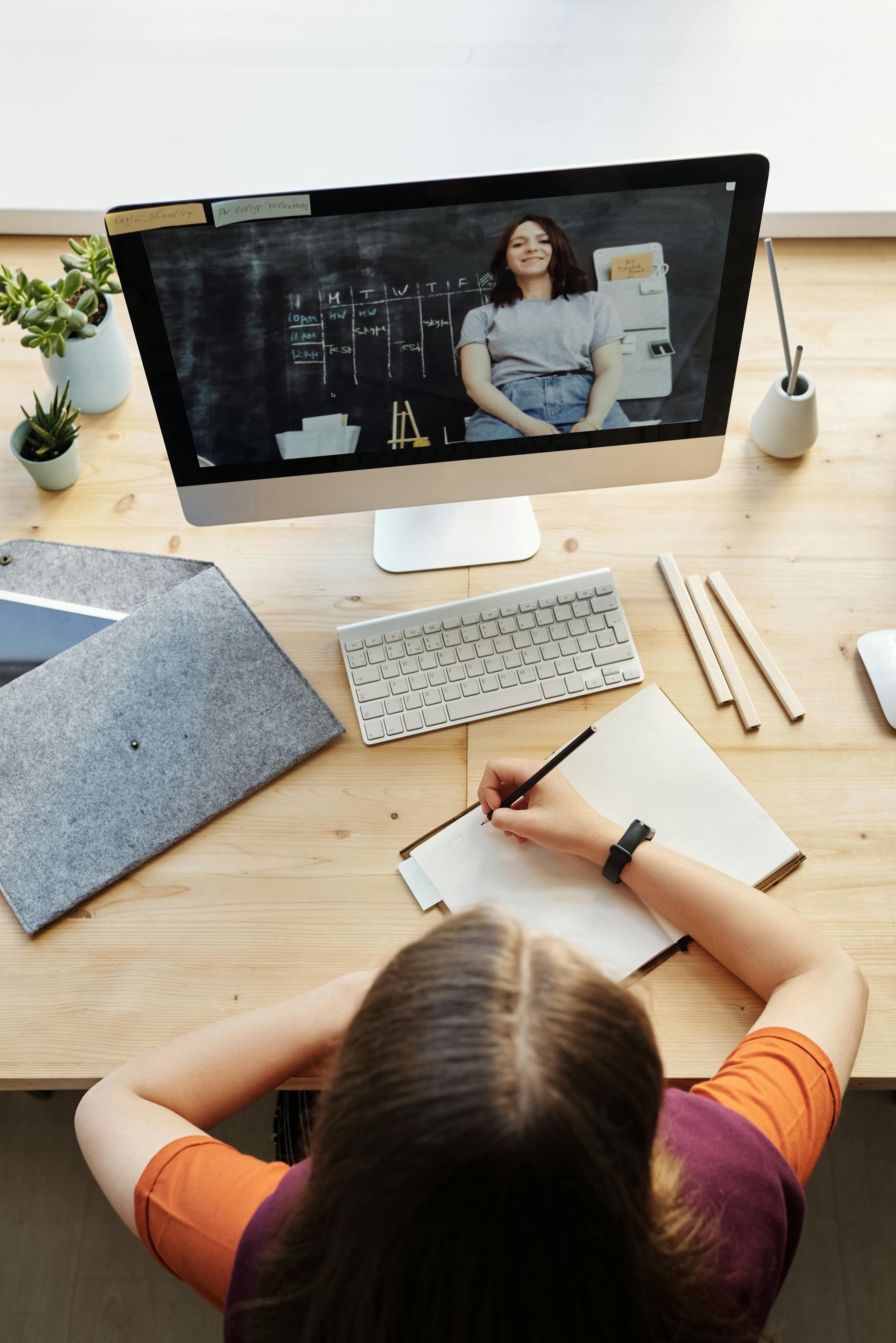 A teenager attending an online therapy session from a home workspace with a Cognitive Analytica psychologist, representing accessible and youth-focused mental health care.