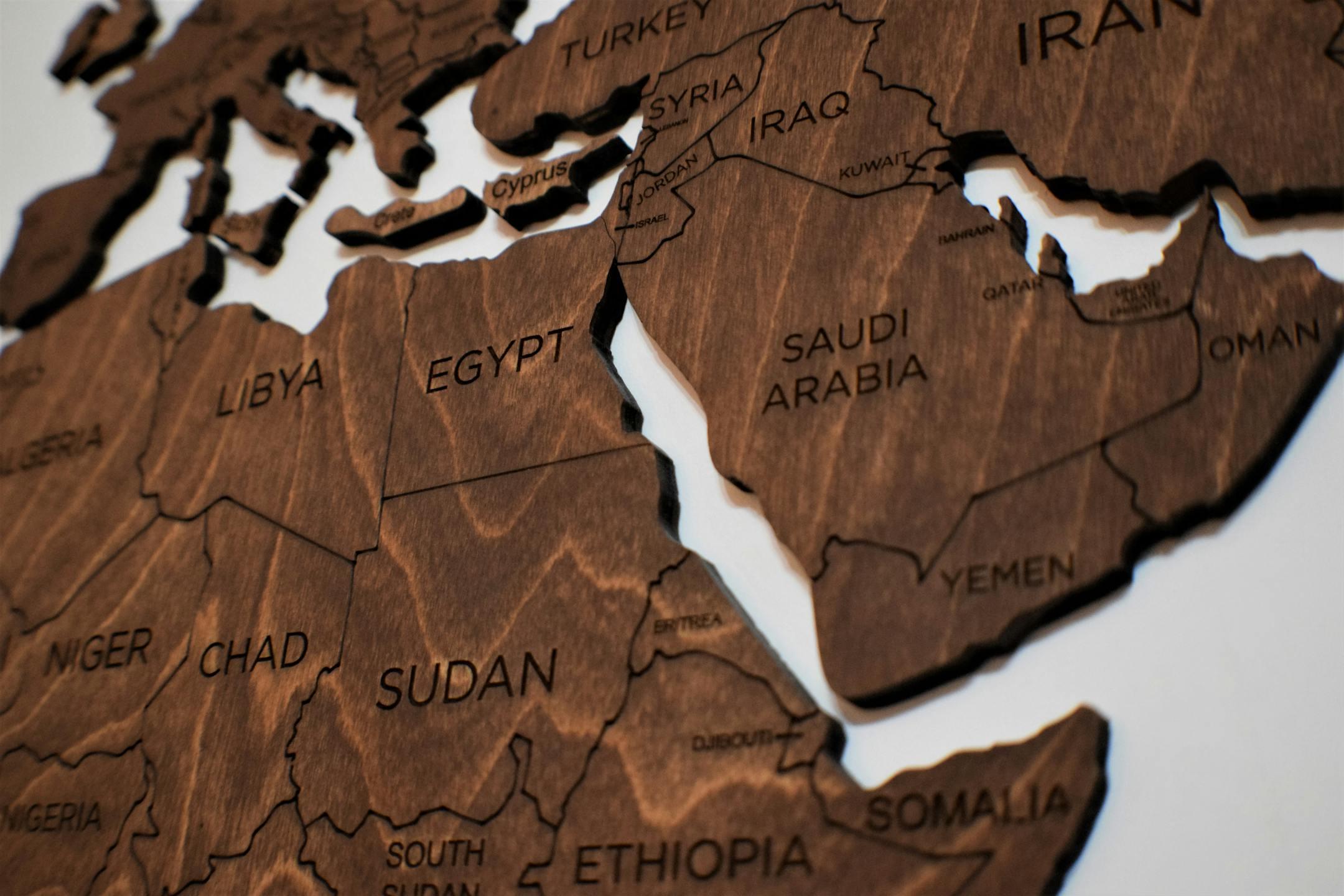Detailed wooden jigsaw map featuring countries from North Africa and the Middle East.
