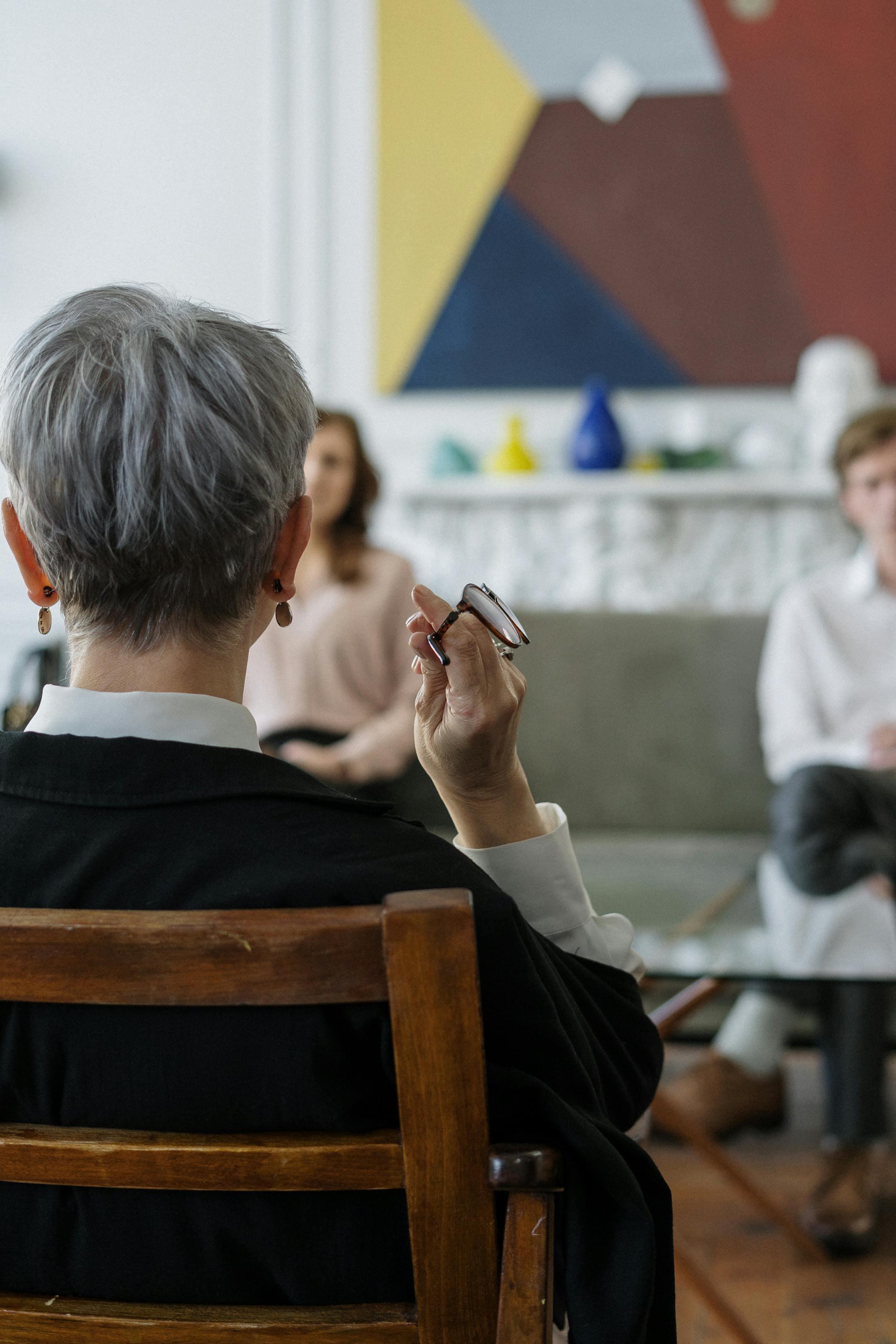 A Cognitive Analytica therapist guiding a couple through a structured counseling session in a modern, professional psychotherapy office in Lebanon.
