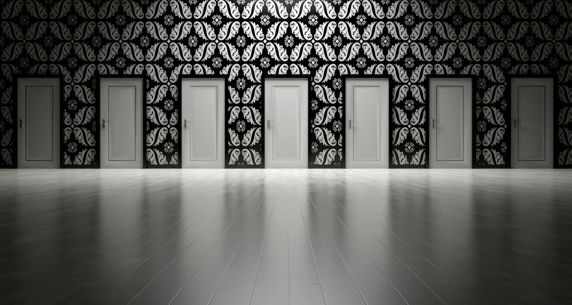Five closed doors in a black and white hallway symbolizing different psychotherapy approaches at Cognitive Analytica in Lebanon, representing choice, growth, and self-discovery.