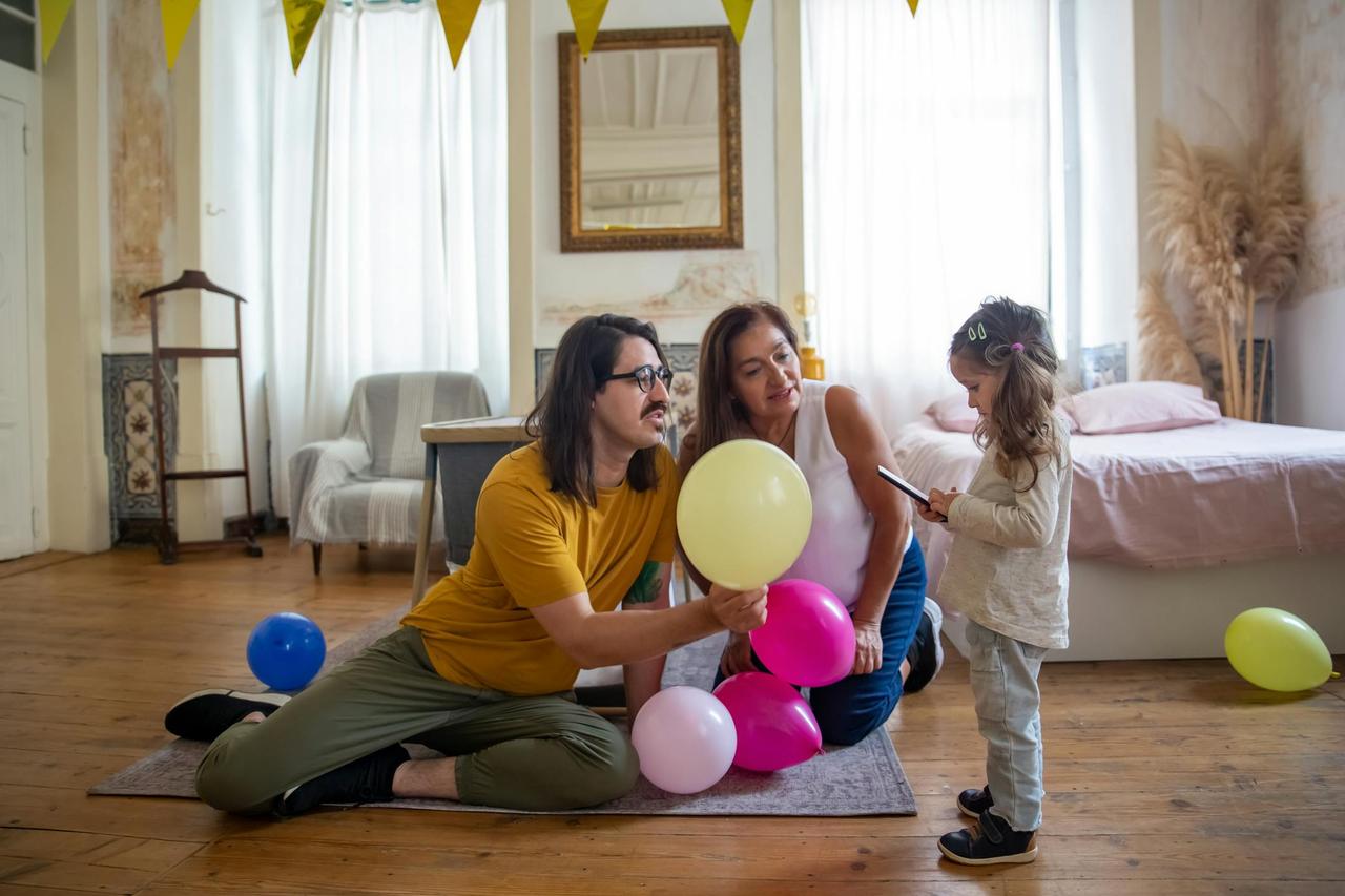 Happy Lebanese family enjoying time together after family therapy, in a warm home setting