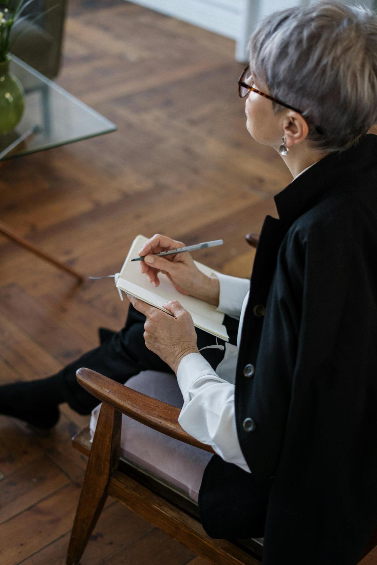 Licensed psychologist in Lebanon taking notes — Cognitive Analytica makes it easy to book online therapy via website or WhatsApp.