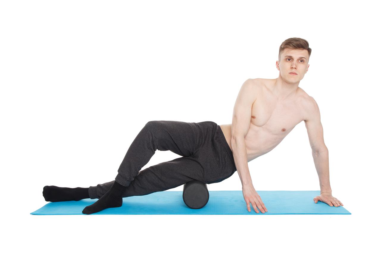 handsome-man-shows-exercises-using-foam-roller.jpeg