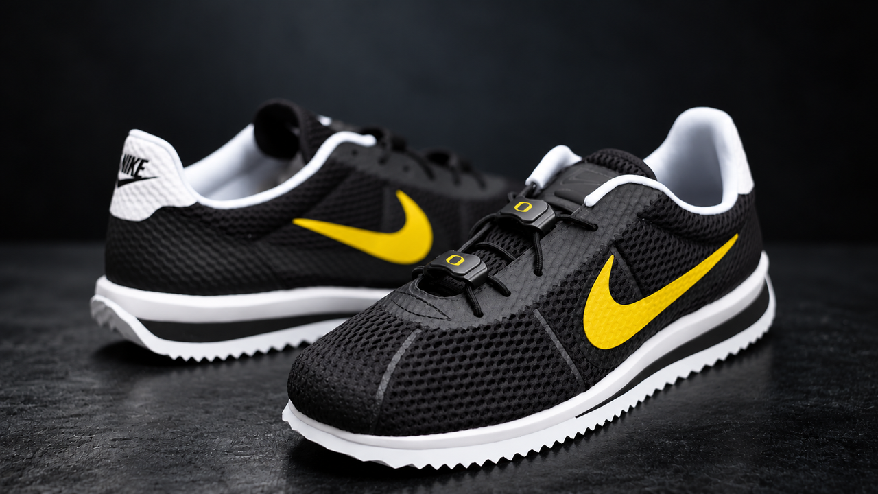 Black and white athletic shoes featuring a quick-lace fastening system