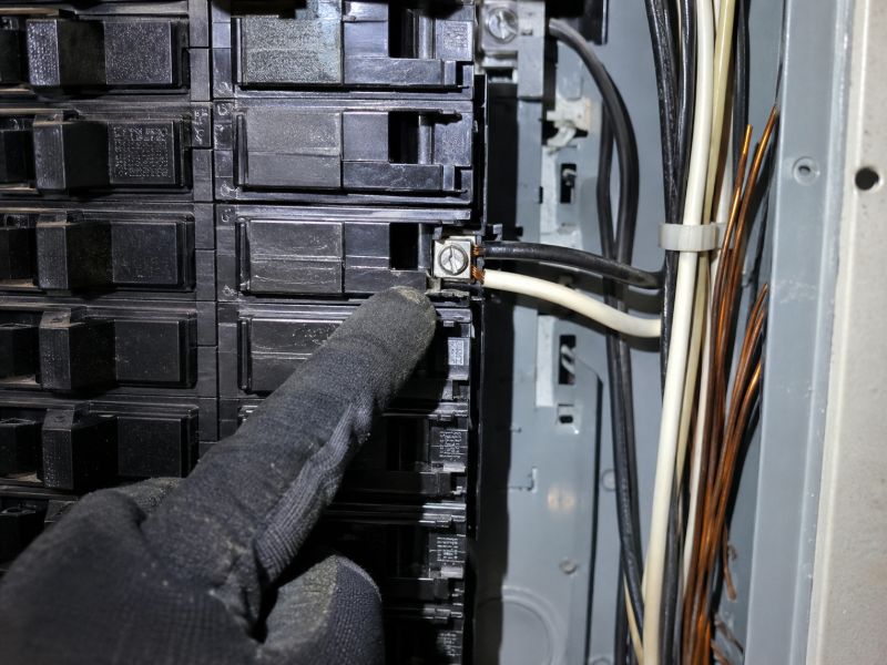 Electrical panel with an identified double-tapped breaker