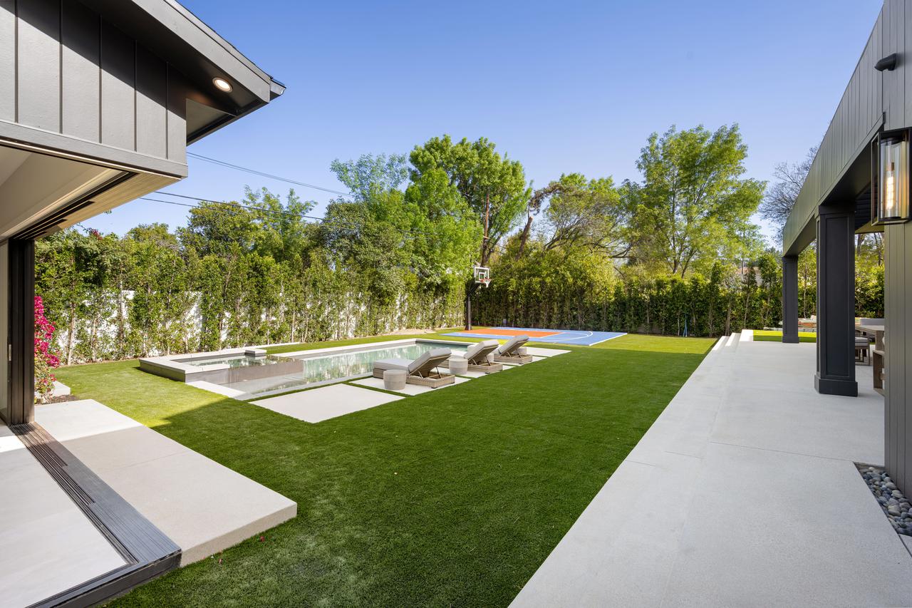 modern-backyard-with-pool-and-basketball-court-2025-02-10-06-40-20-utc.jpg