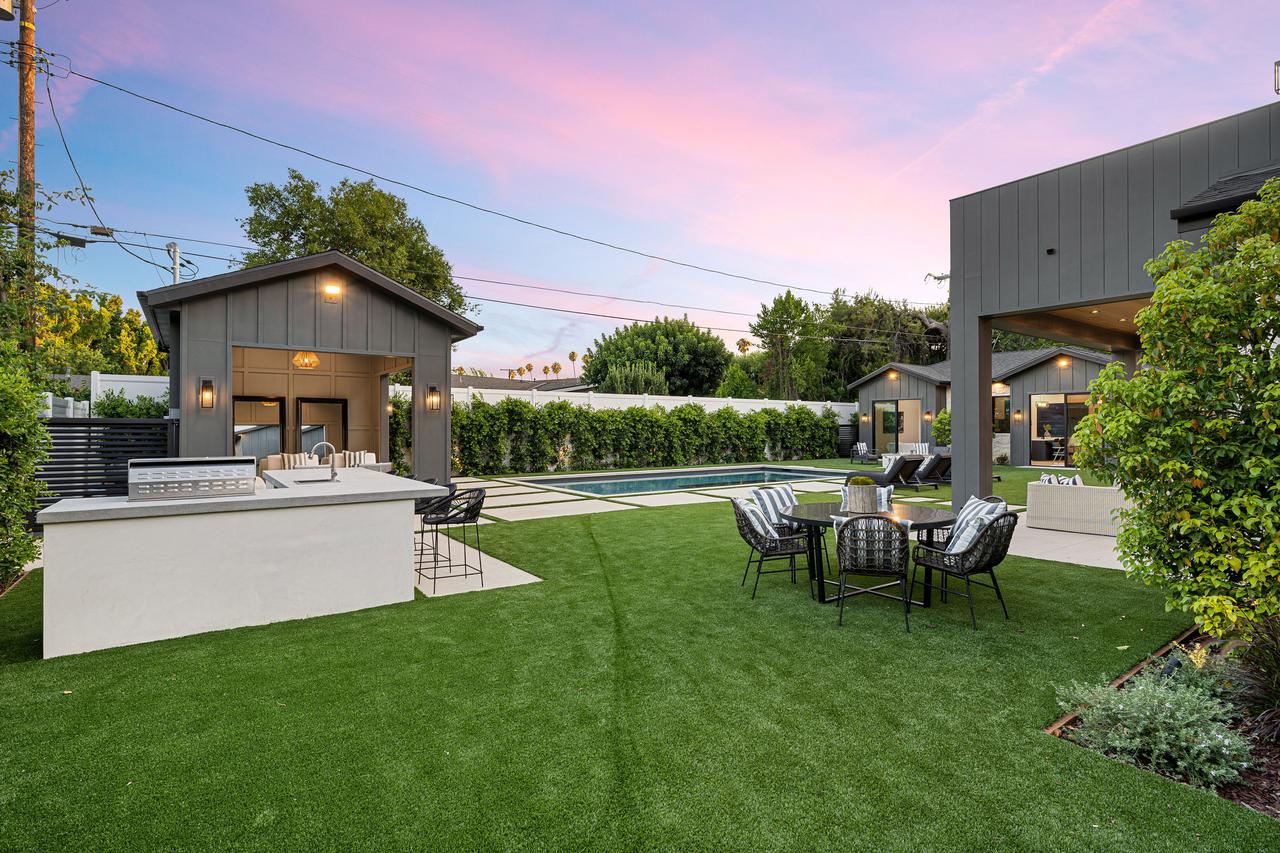modern-backyard-with-pool-and-seating-at-sunset-2025-02-10-06-40-32-utc.jpg