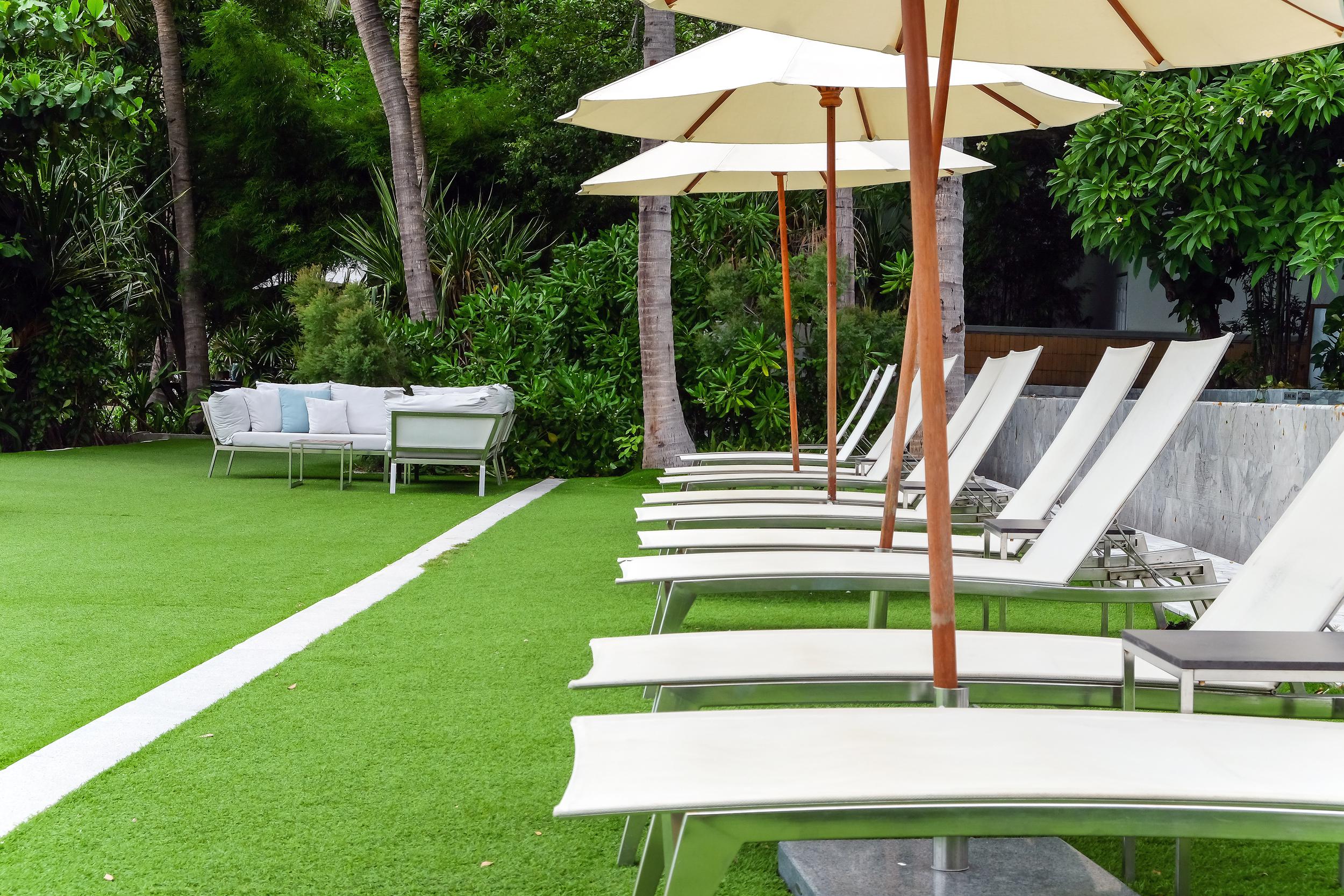 chaise-longue-at-the-pool-in-tropical-resort-2025-03-10-08-44-05-utc.jpg