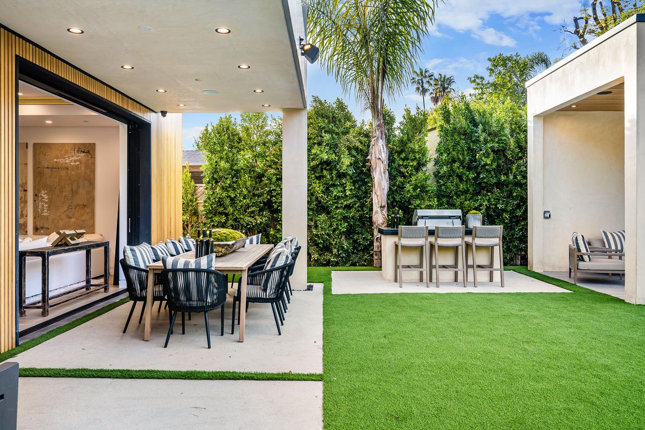 modern-outdoor-dining-area-with-barbecue-grill-2025-02-10-06-40-36-utc.jpg