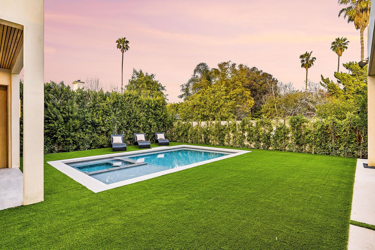 modern-backyard-with-a-pool-and-lounge-chairs-unde-2025-02-10-06-40-21-utc.jpg