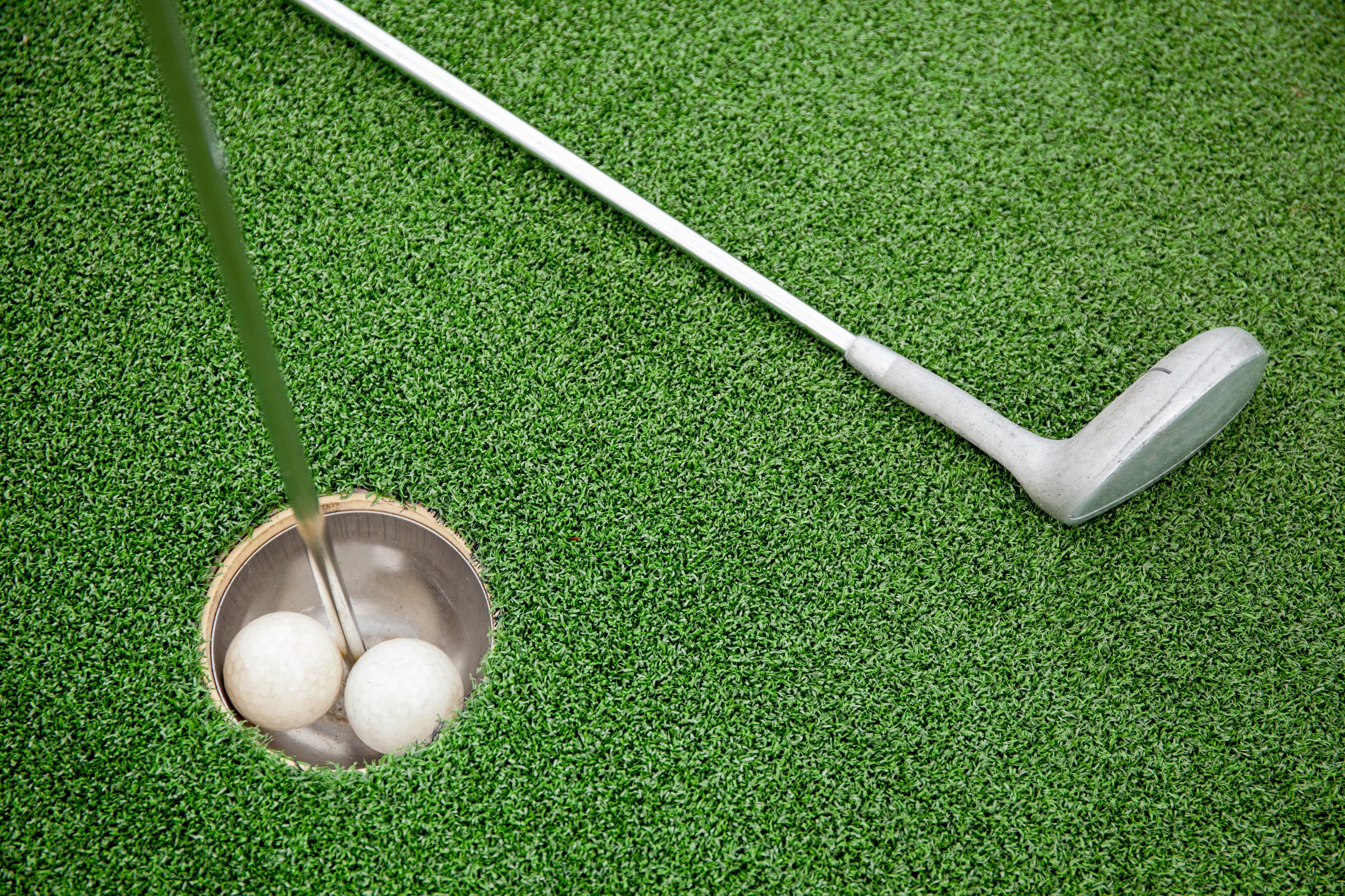 putting-golf-club-on-green-grass-with-golf-ball-in-2025-01-29-05-41-01-utc.jpg