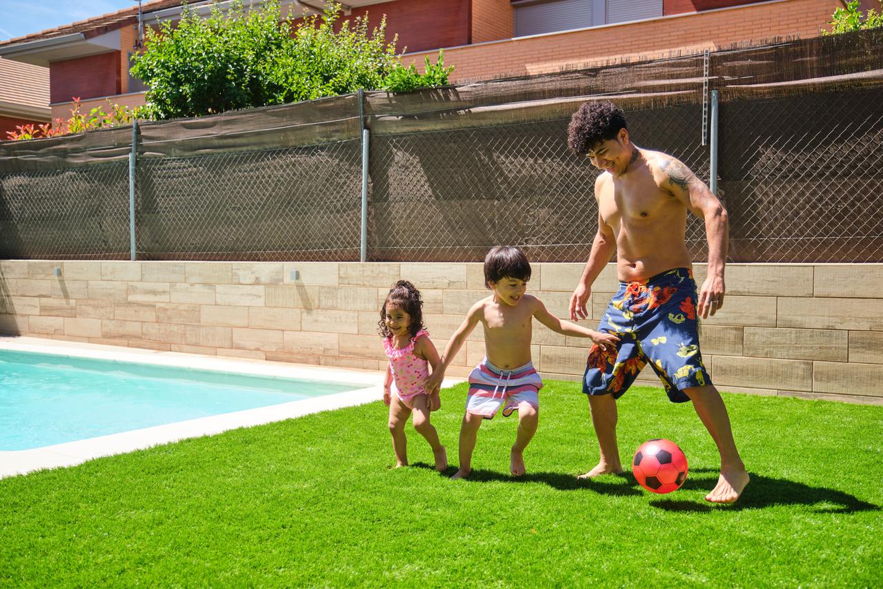 a-man-and-his-two-children-playing-soccer-and-smil-2025-03-16-02-28-47-utc.jpg