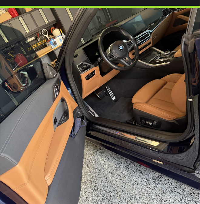 Car detailing service showing spray wax application