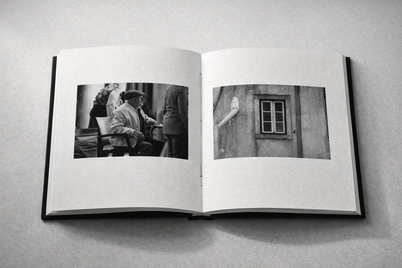 Hands holding handmade stitched photobook