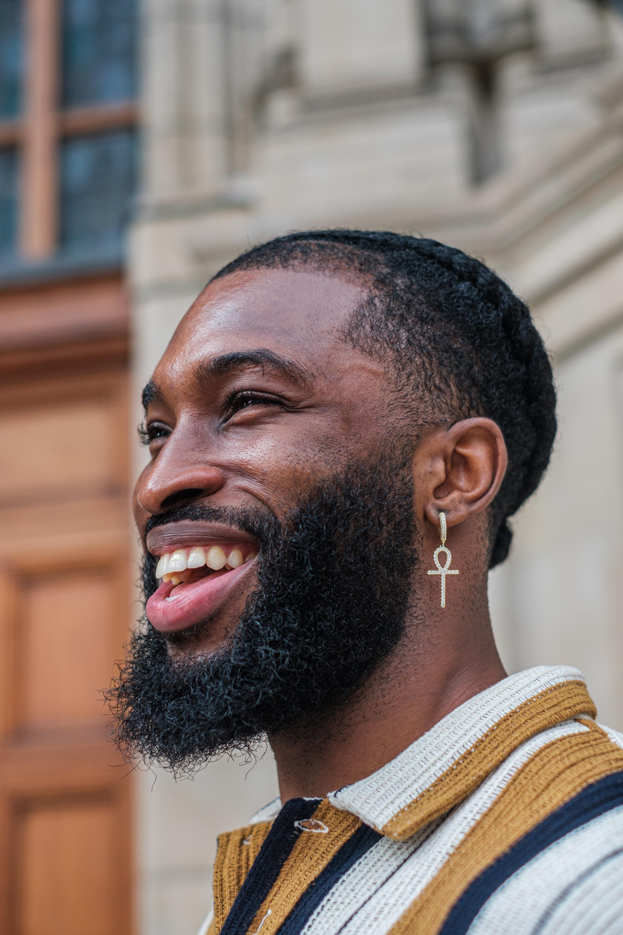 A man smiling and laughing.