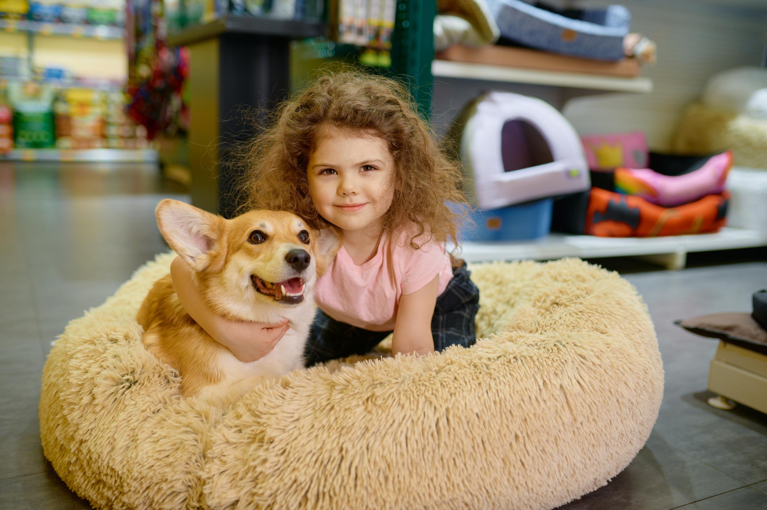 portrait-of-smiling-girl-child-with-her-loving-cor-2023-06-06-18-05-52-utc.jpg