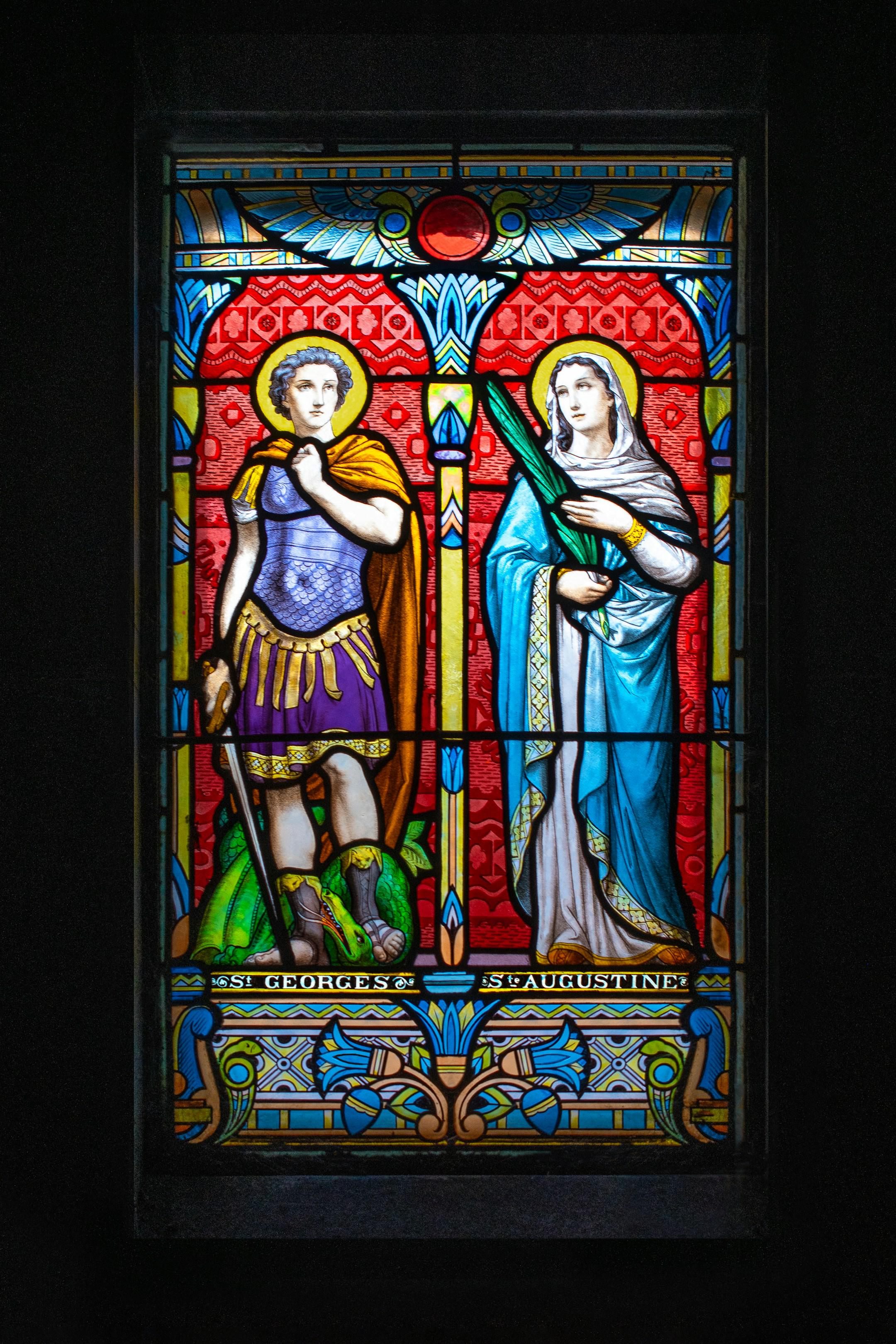 Stained glass, with paint-on-glass window, inside a cemetery sepulcher.