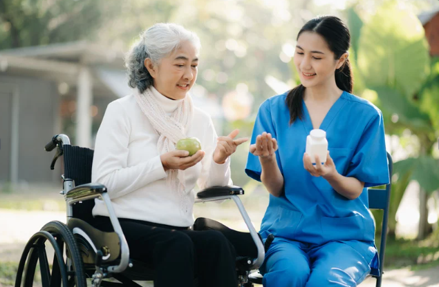 Caregiver and senior preparing a meal together