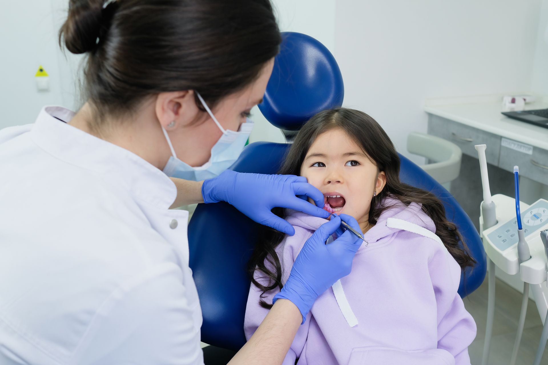 Hygienist with child patient